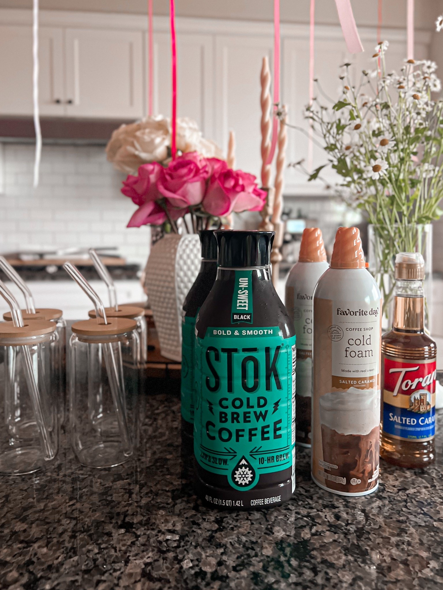Your at-home coffee bar just got a glow-up.
This is my go-to setup when I want a café-style iced coffee without leaving the house. STōK cold brew, a splash of salted caramel syrup, and that dreamy cold foam on top? Yes please.

These aesthetic glass cups with bamboo lids + glass straws make it feel like a treat every time. Perfect for brunches, parties, or just a slow Monday morning.

Linked it all here:
	•	STōK Cold Brew
	•	Favorite Day Salted Caramel Cold Foam
	•	Torani Salted Caramel Syrup
	•	Aesthetic glass cups with bamboo lids
	•	Glass straws
	•	Kitchen vases + faux florals

Tap to shop your own iced coffee moment—because you deserve barista energy at home.

#LTKHome #LTKSeasonal #LTKParties
