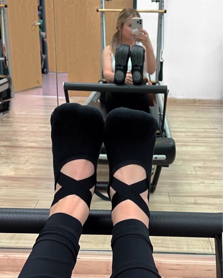 Reformer Pilates class pic or my socks. Found these on Amazon and bought the 3-pack in black. Other color combos available. These stay in place, are inexpensive + were more interesting than basic ankle grippy socks. 

#LTKfit #LTKstyletip #LTKFind