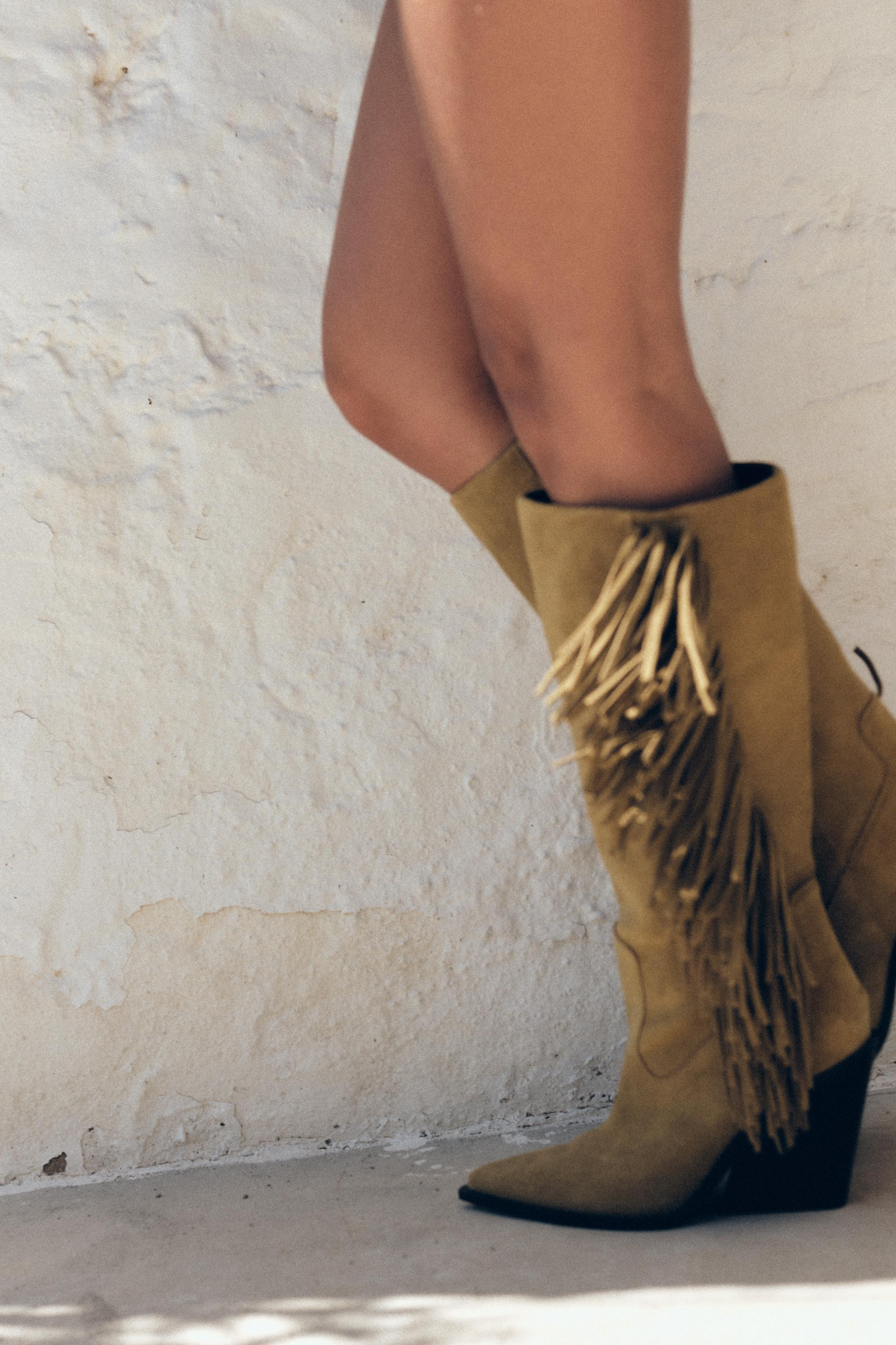 Split leather ankle boots. Fringed detail on the side. Contrast topstitching. High heel. Pointed ... | Zara US