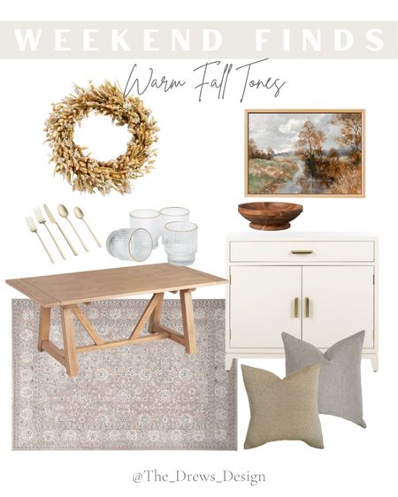 Home decor and furniture with warm fall tone. Neutral throw pillows, white and gold strays cabinet, beige / tan area rug, woos farmhouse dining table, gold flatware, glasses fall wreath 

#LTKhome #LTKSeasonal #LTKstyletip