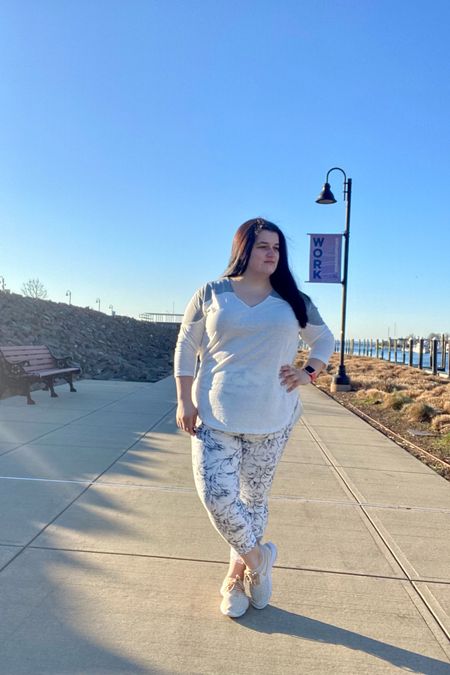 White workout fall outfit. Fitness gear. 3/4 quarter sleeve white basic top. White workout yoga pants. Black and white printed yoga pants with beige sneakers 

#LTKmidsize #LTKFitness #LTKcurves