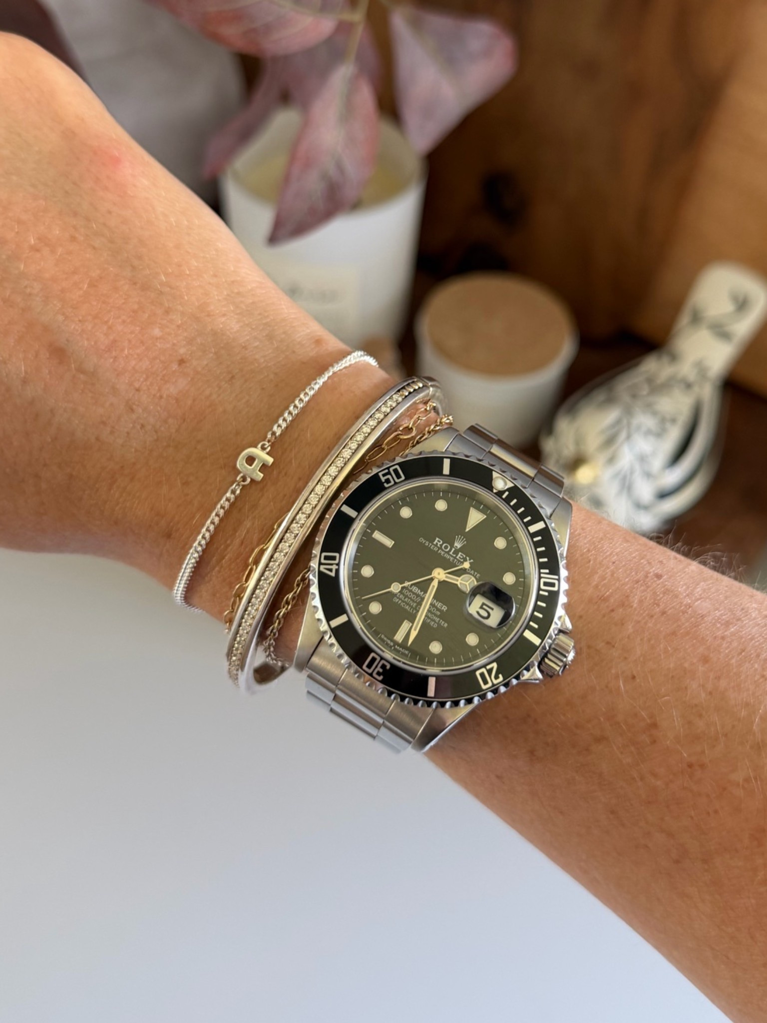 Just got the cutest little sterling silver initial bracelet from Loveweld!
I also linked my Lagos diamond bangle bracelet and my Rolex submariner.