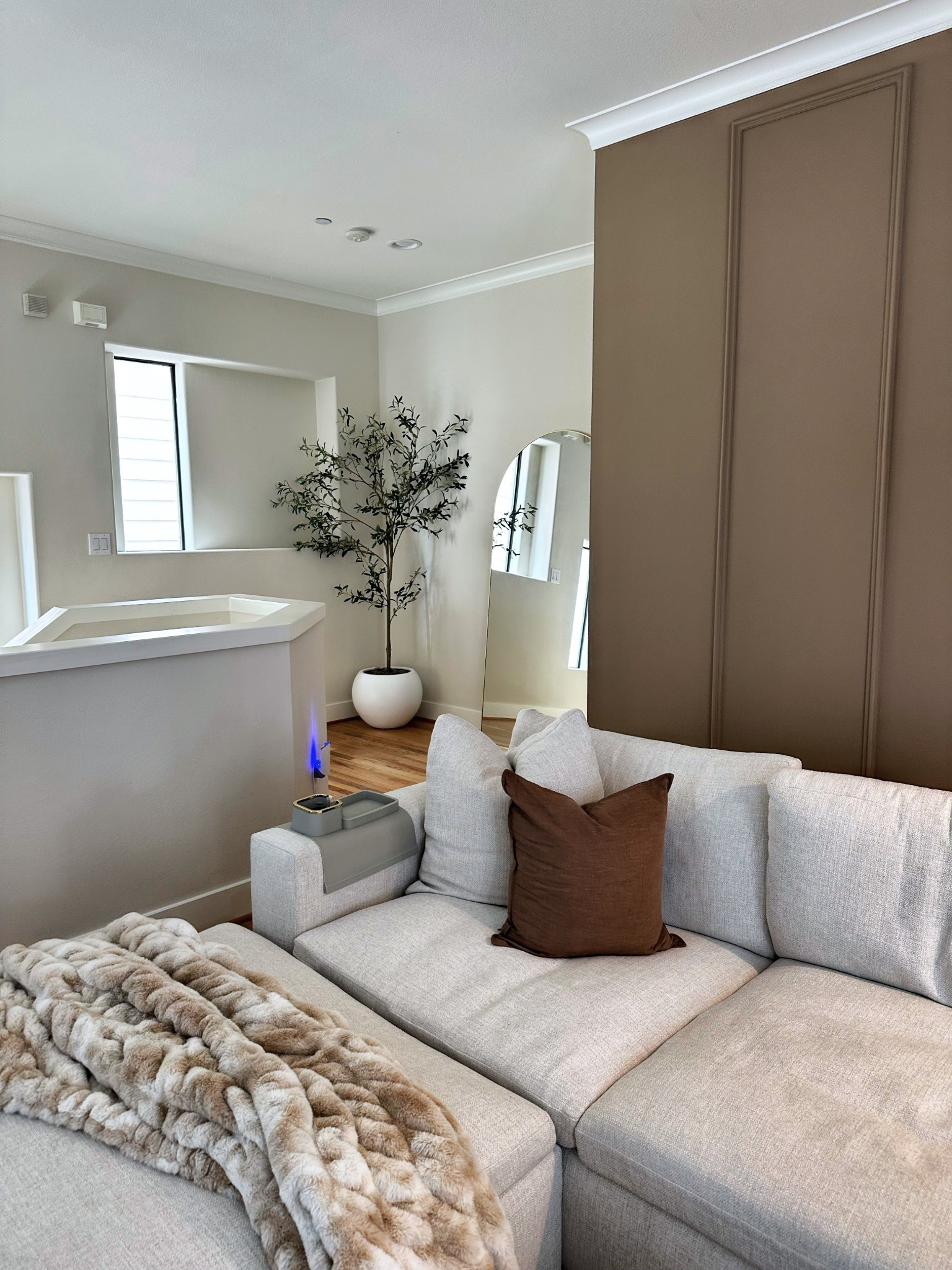 Modern neutral living room vibes 🤍  cozy sectional sofa, oversized faux-fur throw, and large arched floor mirror create a warm, inviting space. Perfect for a minimal yet stylish home. Shop my neutral home decor, sectional sofa, throw blanket, and mirror here

#LTKStyleTip #LTKHome
