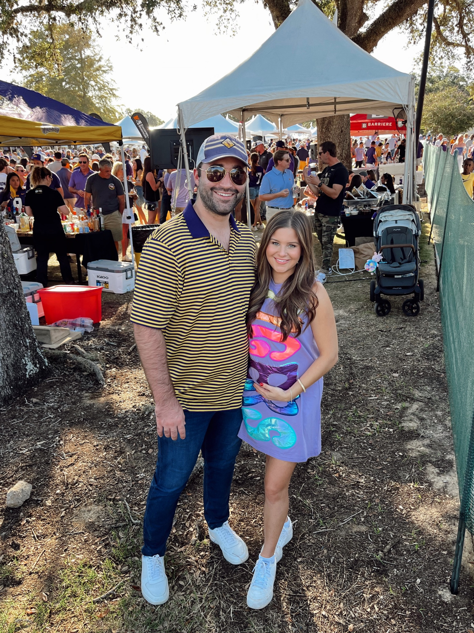 A win of Auburn this weekend! Geaux Tigers! 🐯 I cannot tell you how many people stopped me to say they loved this dress yesterday! Wearing a size XS 

LSU, Gameday Outfit, Tigers, Geaux, Louisiana State University, SEC, Football, Fall Saturday, Tailgate, Queen of Sparkles, Perlis, Gameday Dress, Gameday Purse Strap, White Sneakers, Platform Sneakers, Adidas 

#LTKbump #LTKstyletip