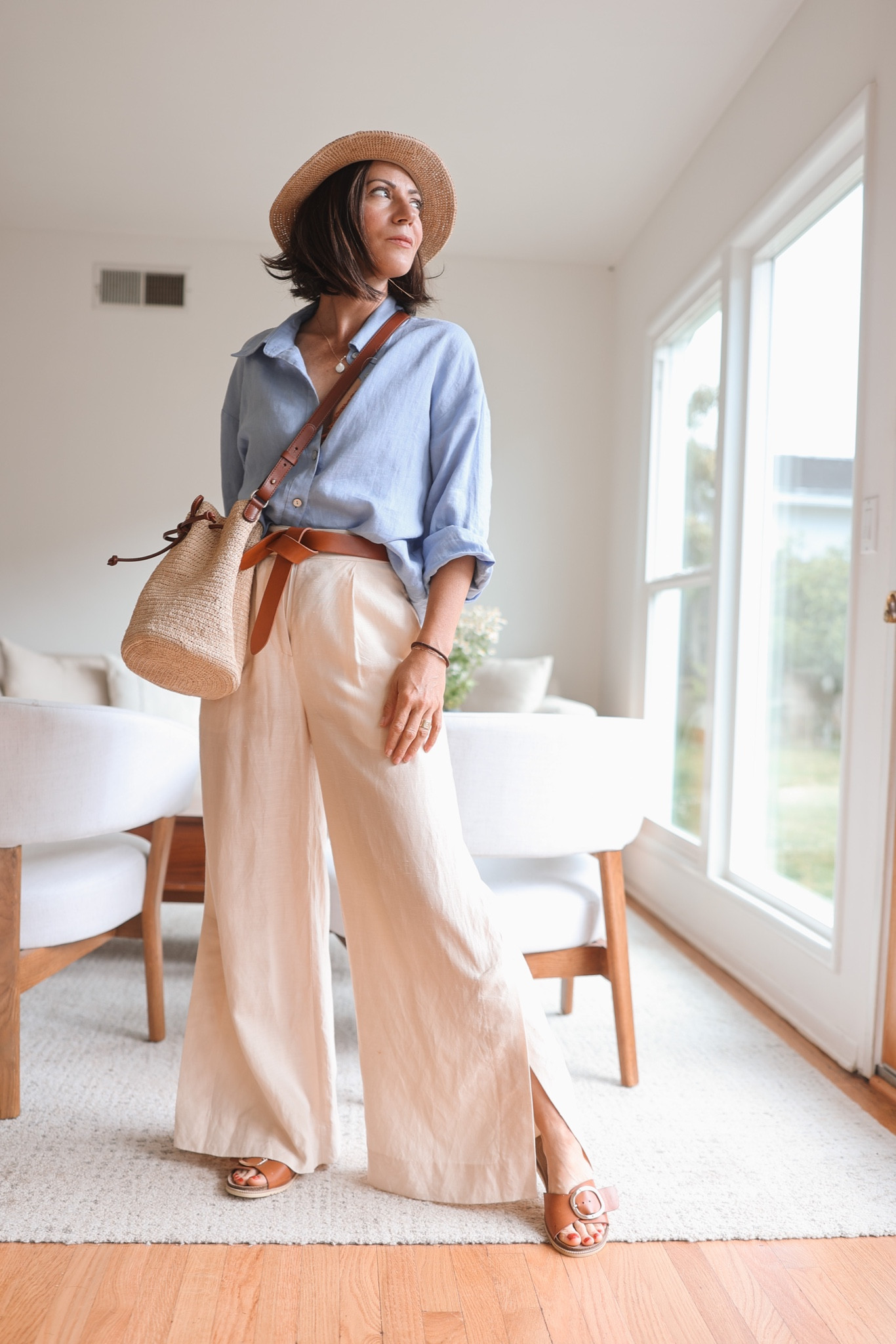 Cream linen/silk blend wide leg pants with a side slit, knotted leather belt, little raffia crossbody bag, blue linen oversized shirt and lookalike Birkenstocks with a big golden buckle.

Shirt: Graecove (can’t link it here, found similar ones)
Belt: Isabel Marant
Bag: Sezane



#LTKSeasonal #LTKstyletip