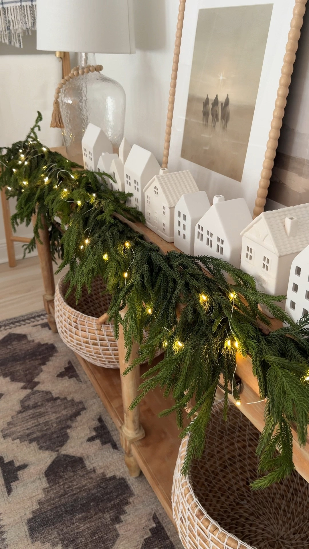 Decorate our console table for Christmas with me! I love this real to touch garland and my village!

#LTKHoliday #LTKHome #LTKSeasonal