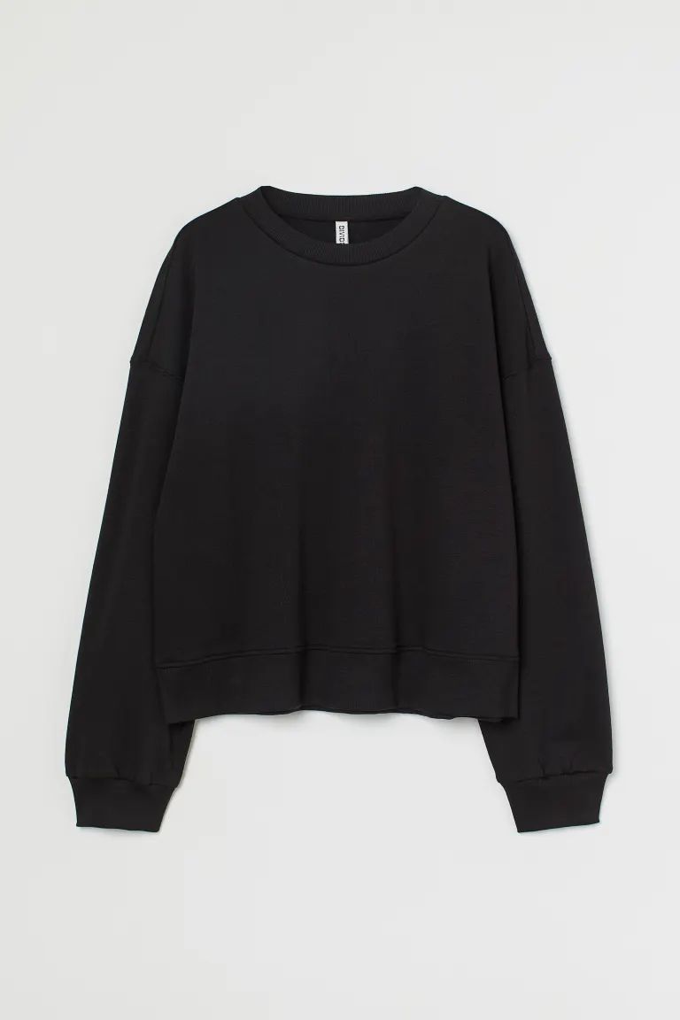 Conscious choice  Sweatshirt in cotton-blend fabric with a soft, brushed inside. Dropped shoulder... | H&M (US + CA)