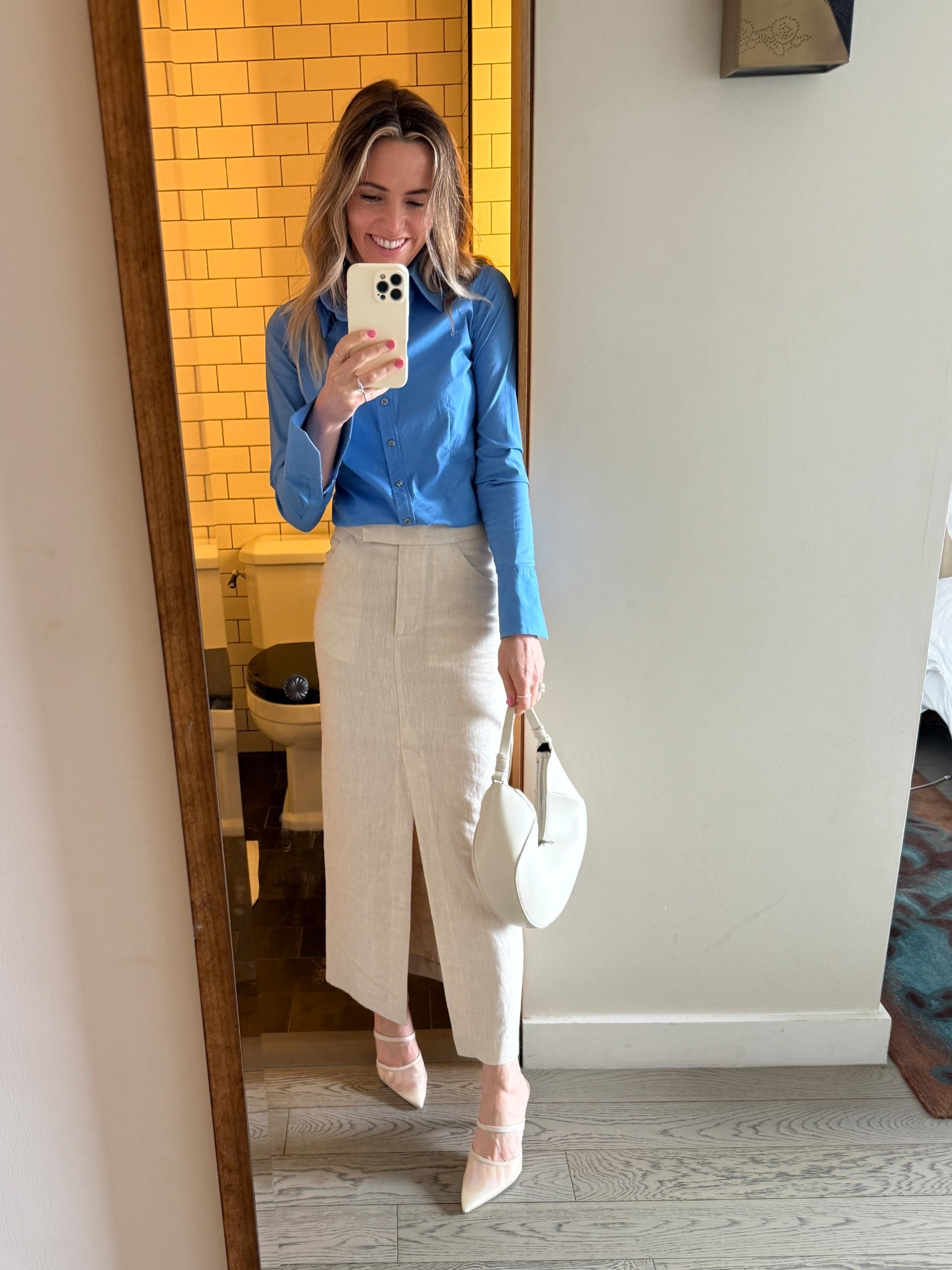 i wore this look for an influencer + creator conference in new york city with my company and wanted something professional, polished, but still unique. a linen pencil skirt felt like such a good option - it's classic and tailored, but a little softer and more modern than the typical office skirt. i paired it with a classic blue button down and neutral accessories, and it was comfortable yet elevated for a full day of panels and networking. Wearing a size small in the skirt. The linen pencil skirt is breathable, structured, and easy to move in. The blue button down is very quirt luxury meets corporate girlie aesthetic and the neutral heels and structured shoulder bag tie it all together. #LTKworkwear #LTKStyleTip #LTKSeasonal #nycoutfit #corporategirl #conferenceoutfit #capsulewardrobe #falloutfit

#LTKWorkwear #LTKSeasonal #LTKTravel