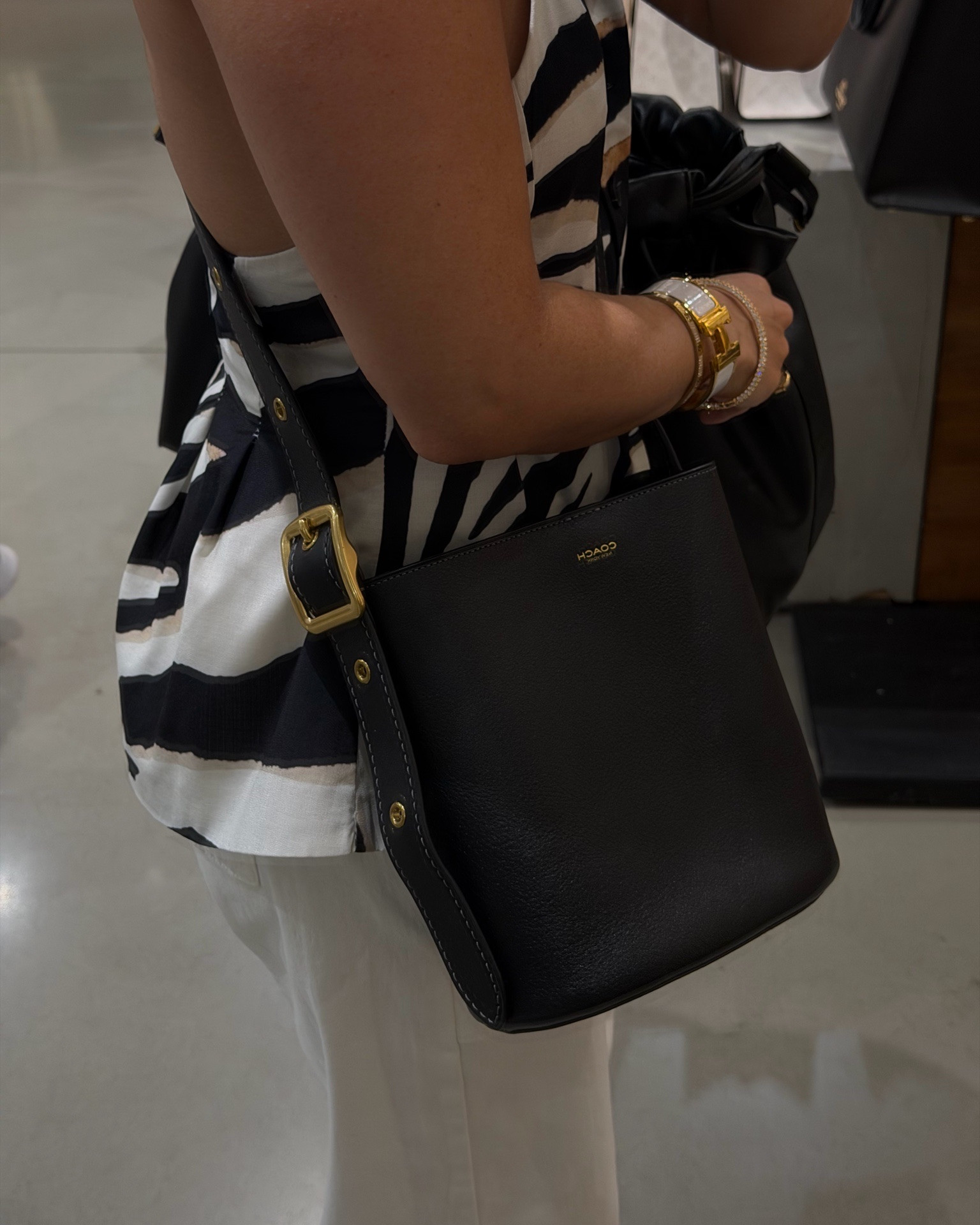 Cute coach bucket bag I got my mom for Mother’s Day 🖤!

#LTKPetite #LTKootd