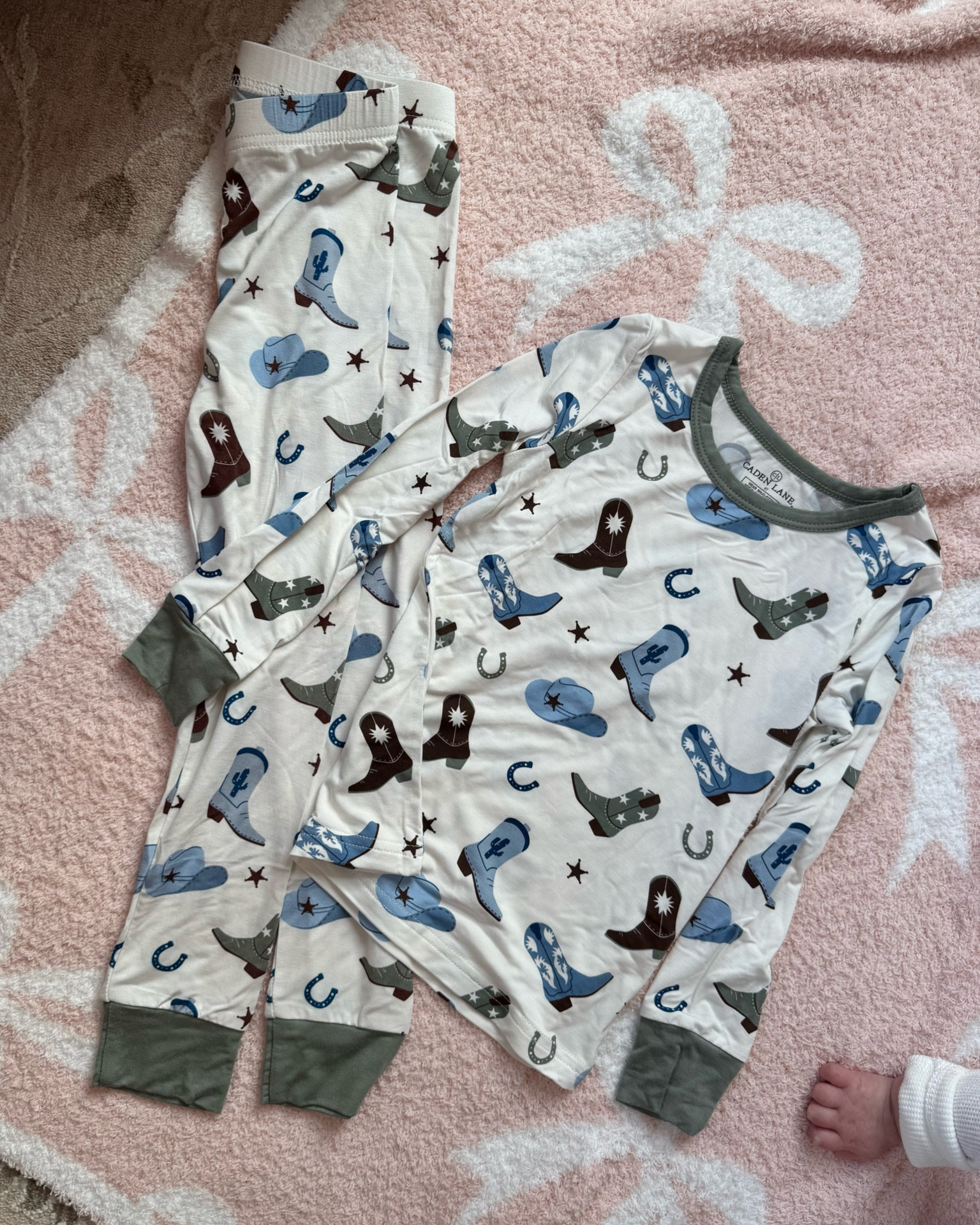 Fell in love with this print!!! 🤠 Ollie was so excited for these 🩵 cowboy boots & hats for him, size 4T! 

Caden lane, toddler bamboo pajamas,Cowboy print, Caden lane partner, toddler boy, boy print 

#LTKKids #LTKFindsUnder50 #LTKFamily