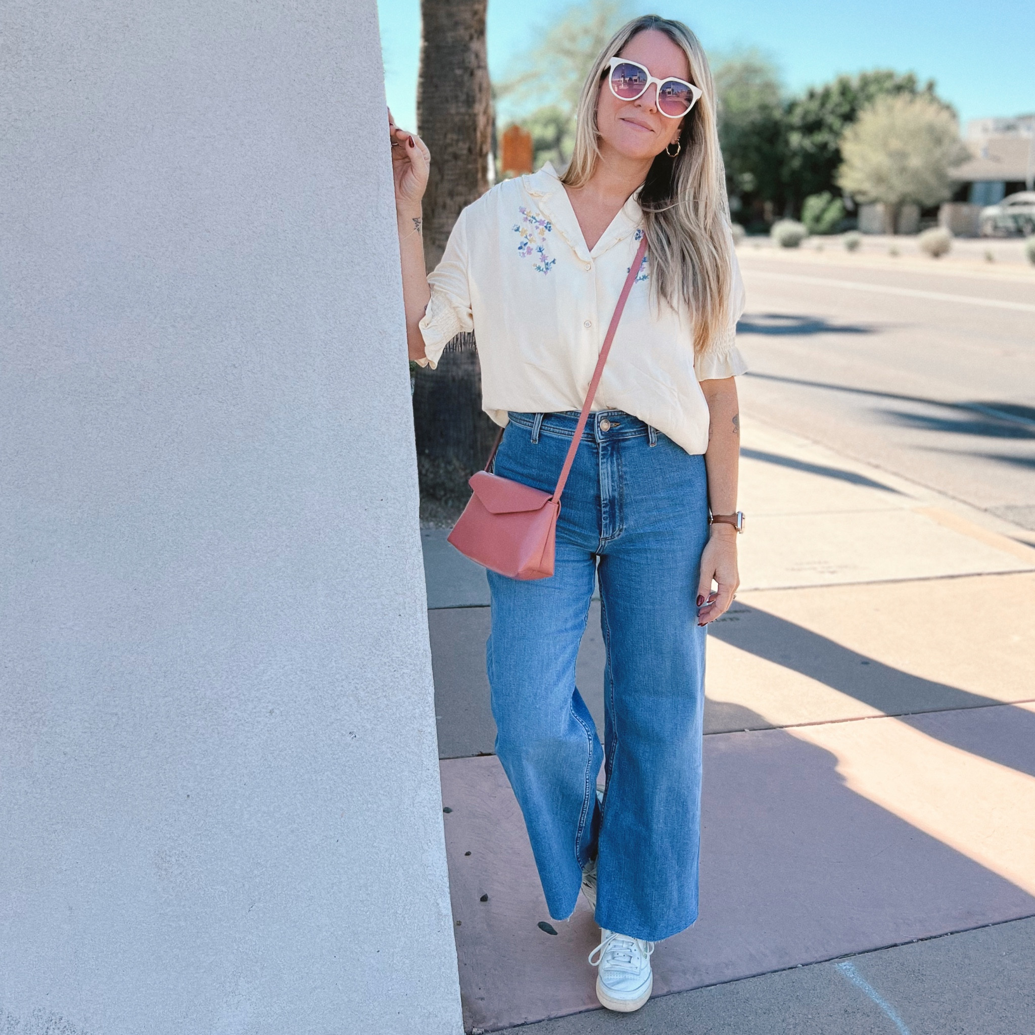 Throw on a floral embroidered blouse paired with high-waist, wide leg denim and retro trainers for an easy, vintage inspired look.

#LTKstyletip #LTKSeasonal #LTKsalealert