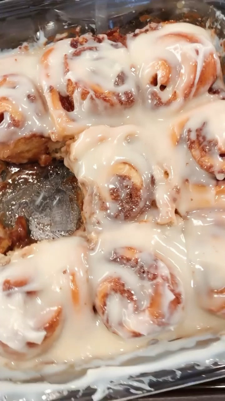 Homemade Cinnamon Rolls

Dough
1 cup warm milk
2 1/2 tsp instant yeast
2 large eggs, room temp.
1/3 cup butter, melted
1/2 cup sugar
1 tsp salt
1 tsp vanilla
4 1/2 cups flour

Cinnamon Filling
1/2 cup butter, room temp
1 cup brown sugar
2 tbs cinnamon
1 tsp vanilla
1/2 cup heavy cream (to pour over rolls prior to baking)

Frosting
4 oz cream cheese, room temp
1/3 cup butter, room temp
2 cups powdered sugar
1/2 tbs vanilla

To make the Dough:
Add warm milk, and yeast to a bowl. Mix until yeast begins to foam. Add sugar, eggs butter, and vanilla until combined.
Add in flour and salt, one cup at a time until combined. 
Mix for about 5-7 minutes, until dough is elastic and smooth. Add flour (if needed) to get to this point. 
Spray the bowl with cooking spray. Add dough to bowl, cover, and let rise until doubled in size. 

While the dough is rising prepare filling and frosting. 

Cinnamon Filling:
Mix together all the ingredients for the filling, except the heavy cream, until well combined. Set aside. 

Frosting:
Mix together all ingredients until well combined. Leave out at room temp until ready to use.

Rolls:
Sprinkle the cutting board or counter with flour. Take half of the dough and roll out into a rectangle about 10x14, or until it's about 1/2 inch thick. 
Spread half of filling over the entire dough area. 
Roll the dough up tightly, starting on the long end. 
Cut roll into 6 even slices.
Repeat with other dough/filling. 
Place rolls into a greased baking dish, with room around each roll. 
Cover pan, if baking now, or cover and place in fridge if baking later. If baking later, take out of fridge 30 mins prior to baking, to let rise. 
Let rolls rise for 30 minutes, pour heavy cream over each roll then bake in the center of the oven at 375 for 20-22 minutes, until lightly golden brown. If rolls are browning too fast, place foil on top while they're baking. 
Once done, spread frosting over each roll and serve! 

