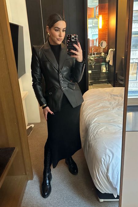 All black everything. This cashmere blend midi dress is perfect for layering this season. Runs TTS & is currently on sale! (I’m wearing size S.) The faux leather blazer is a total statement piece and has moderate  shoulder pads elevating the entire look  

Veronica Beard. blazer, leather, sweater dress, boots, theory, reformation 