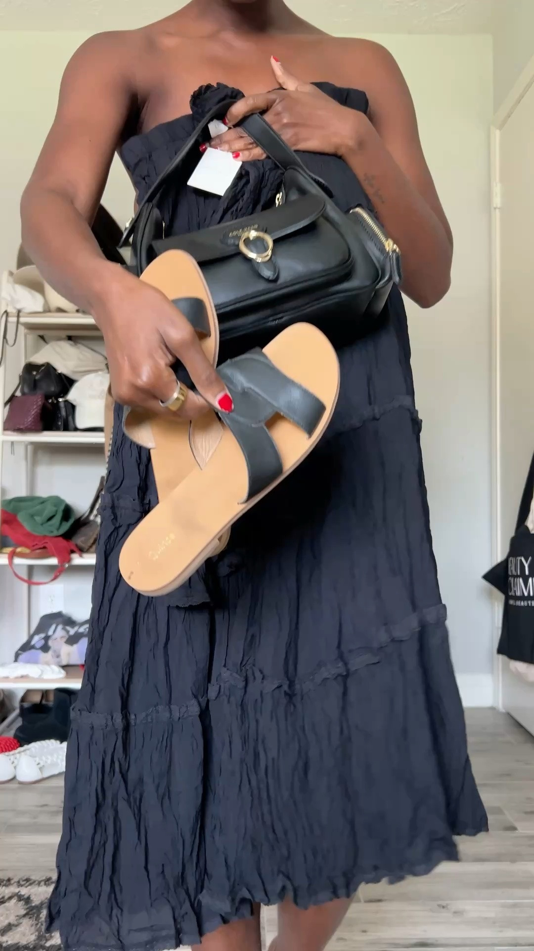 Breezy outfit! Black cotton front tie shirt and black maxi skirt, black leather slides and black Cole haan purse.

#LTKgrwm #LTKootd #LTKOver40