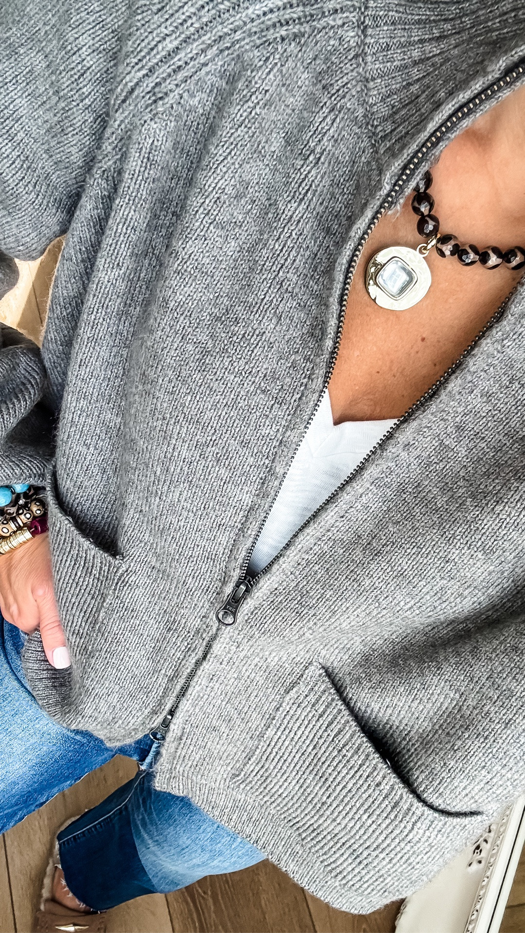 A small zip up cardigan sweater. XS white V-neck T-shirt. Jeans 25. Clogs size down. Jewelry code HOUSEOFLEO20

#LTKOver40 #LTKPetite