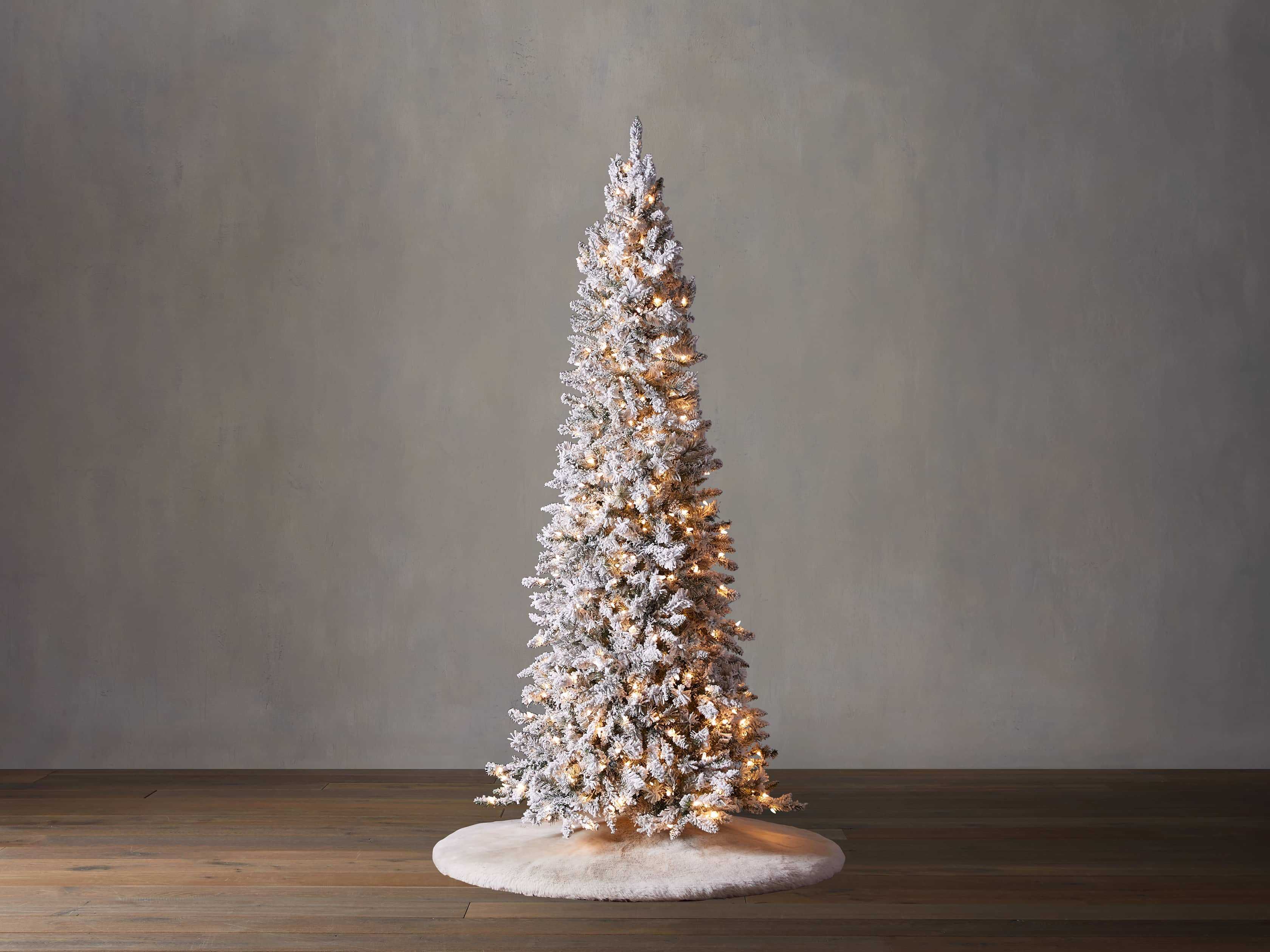 Craft a winter wonderland for the holiday season. Inspired by natural spruce trees, our Pre-Lit F... | Arhaus