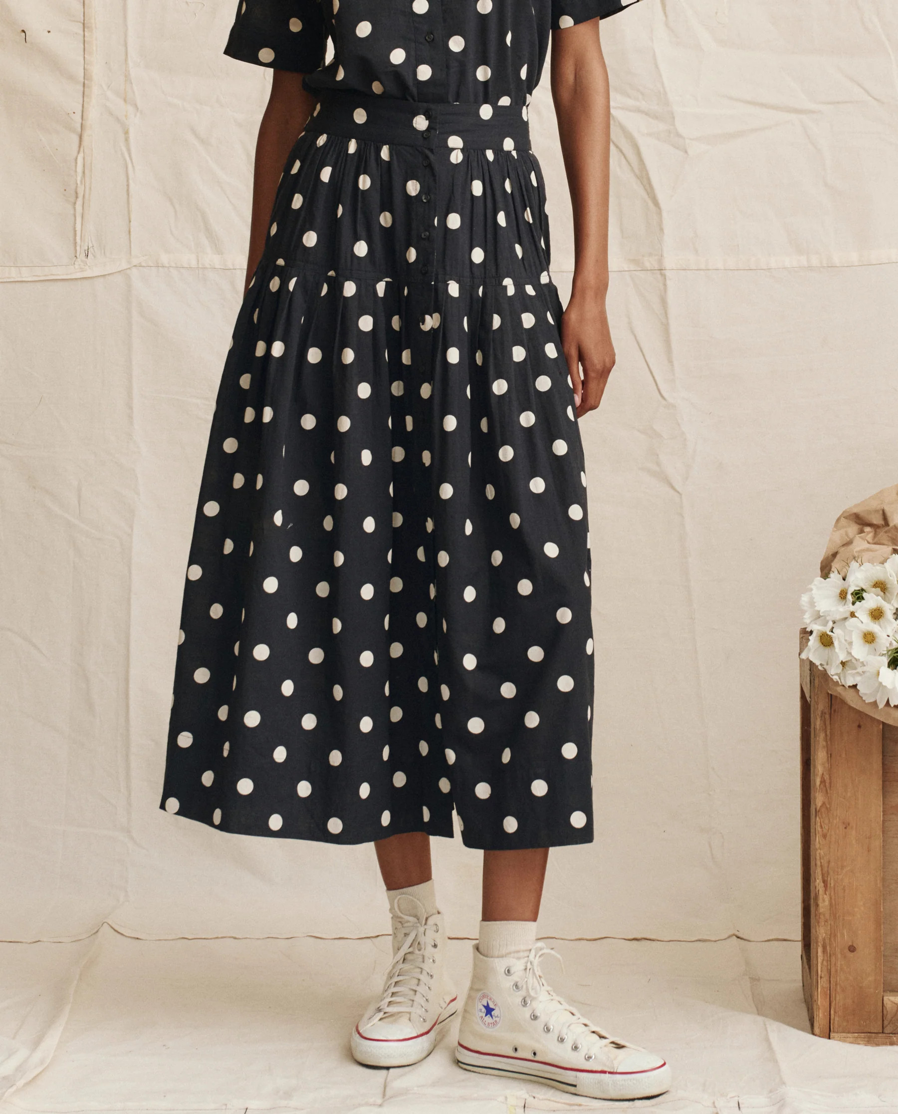 The Highland Skirt. -- Navy with Cream Polka Dots | THE GREAT.