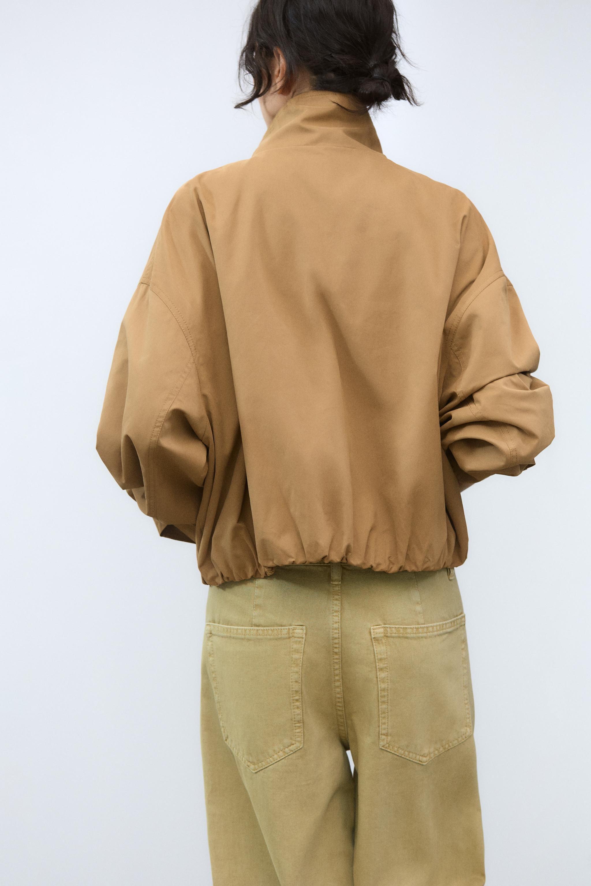 High-neck, long-sleeved jacket with pleated cuffs. Side pockets. Lined. Elasticated, gathered hem... | Zara UK