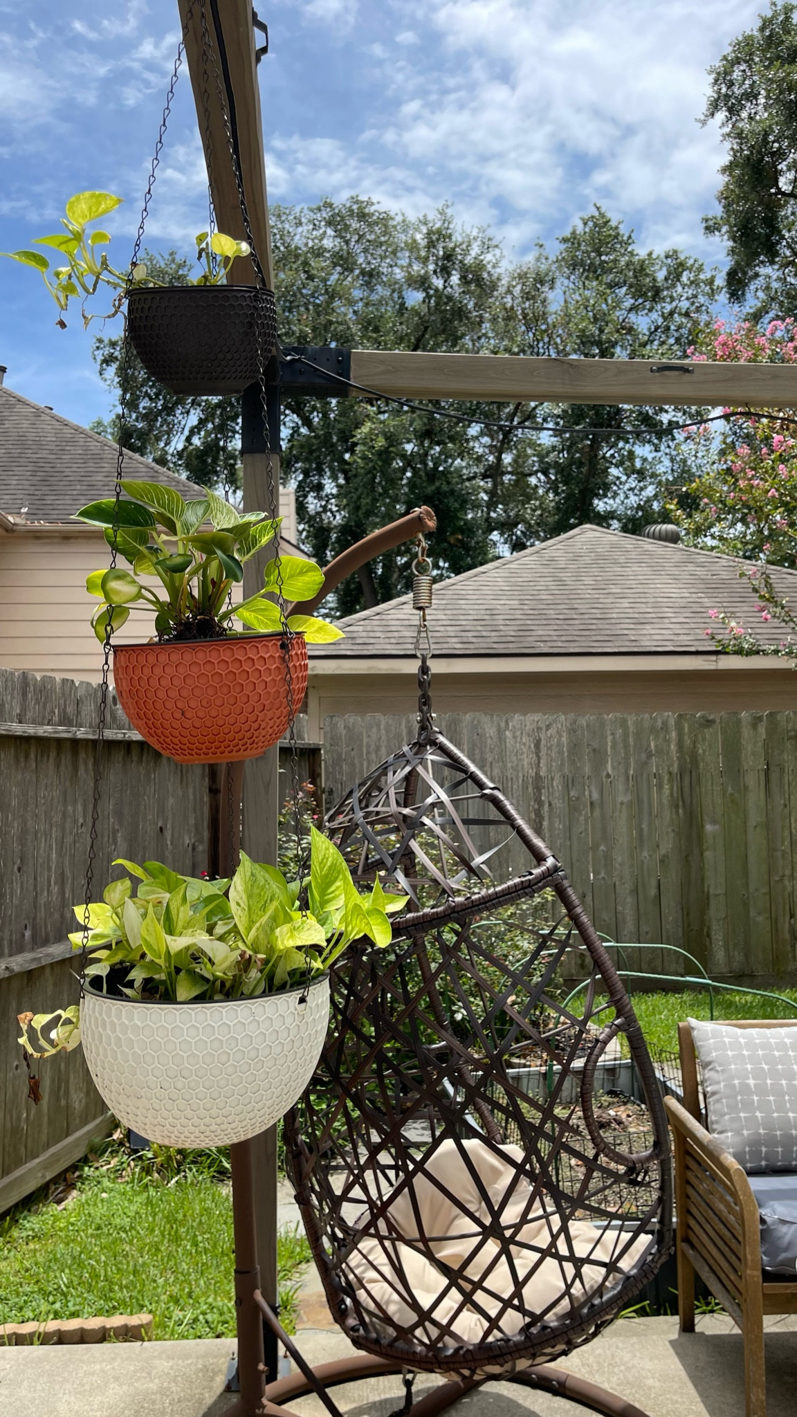 Hanging planters for outdoors and swinging hanging outdoor egg chair complete the perfect summer backyard oasis by providing fun seating and bit of greenery to look at. It makes the patio a place our family want to hang around! 

#LTKSeasonal #LTKHome