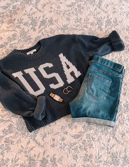 Cute summertime outfit. BBQ outfit. Cute 4th of July outfit. Casual summer nights look for moms. Usa sweater. Patriotic simplistic look. Good jewelry. Coastal grandmother. Oversized sweater with shorts  

#LTKFind #LTKSeasonal #LTKunder50
