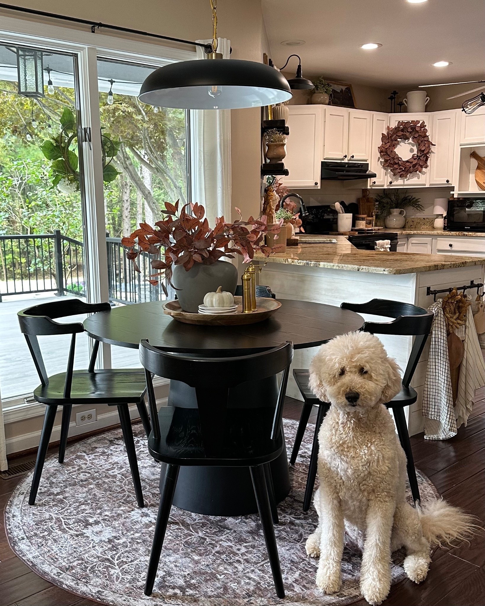 ON SALE Breakfast Nook Finds 🍁
Follow @farmtotablecreations on Instagram for more seasonal home styling ideas!

I brought in warm autumn tones with faux stems, a ceramic pumpkin, and a beautiful wood tray—styled on our black pedestal table and rounded out with sleek black chairs. The muted rug adds the perfect grounding layer, and yes, Bella approves of it all. 🐾

#roundrug #diningroomstyle #pedestaltable #fallhomedecor #ltkhome #kitcheninspo #diningroomdecor #fallvibes #interiorstyling #homedetails #blackdiningchairs #cozyliving #amazonfinds

#LTKHome #LTKSaleAlert #LTKSeasonal
