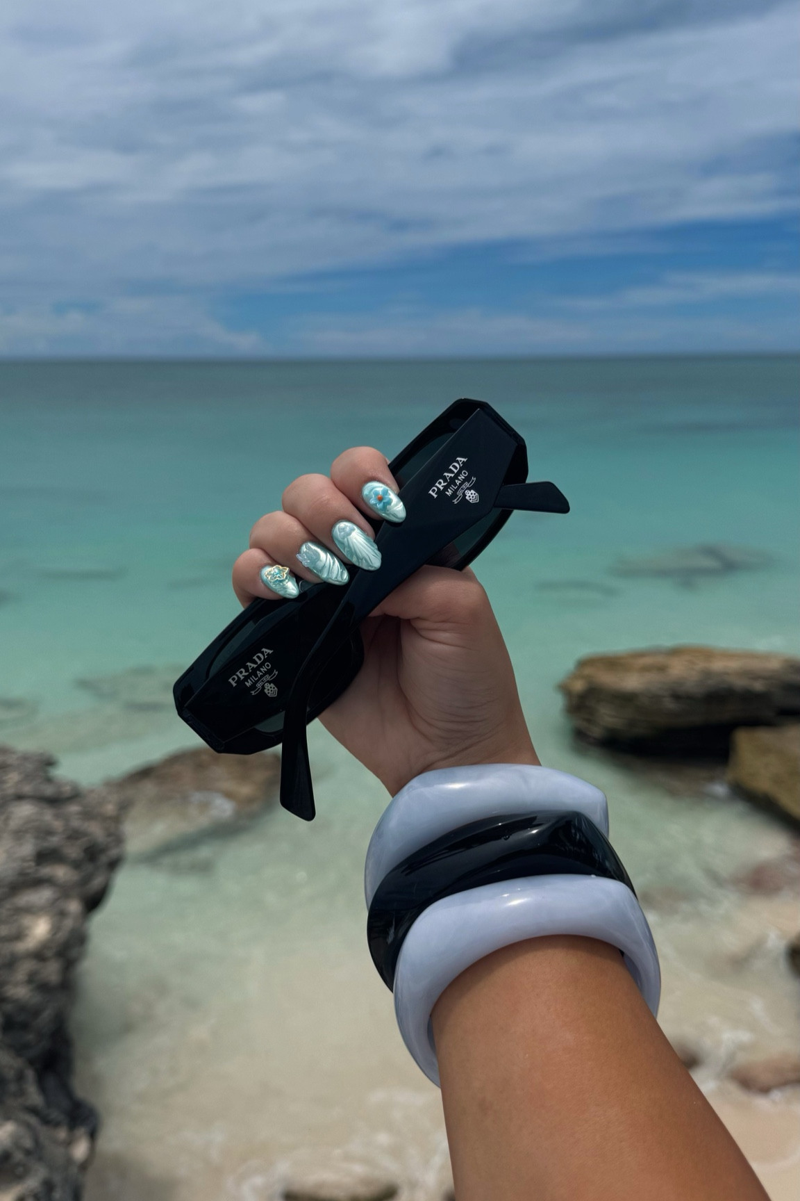 the perfect summer accessories 😎🩵🖤 added a dupe for the Prada’s below as well! 

#LTKTravel #LTKStyleTip #LTKSummerSales