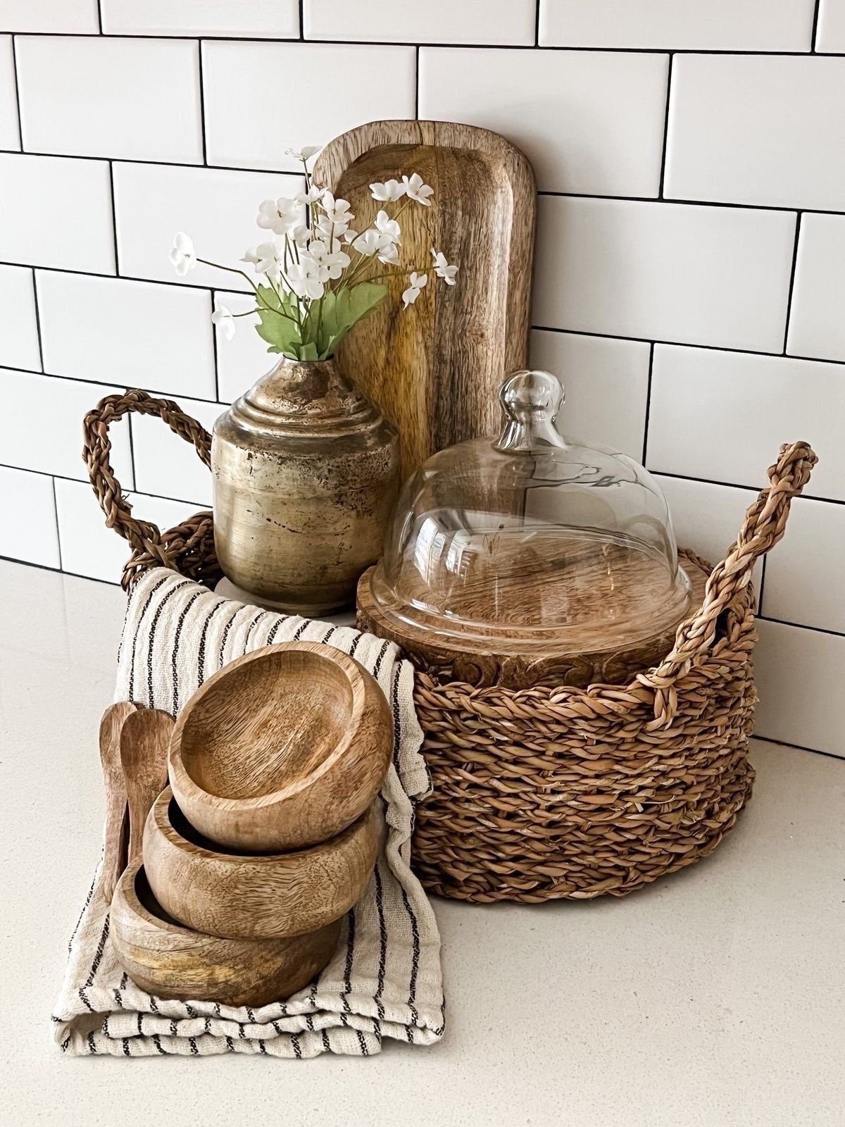 Every countertop can tell a story of home and hospitality. This rattan basket with wooden bowls and a cutting board brings timeless farmhouse style and practical beauty to your kitchen.🧺
Shop this cozy kitchen set in my LTK.

#LTKHome #LTKU #LTKSpringSale