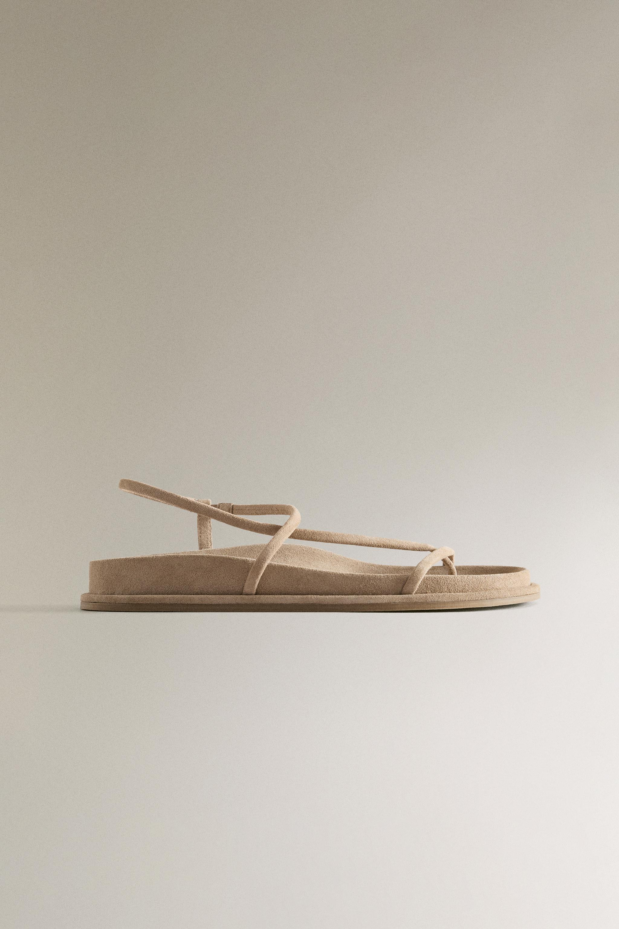 Flat leather sandals with thin straps and a toe divider. | Zara UK
