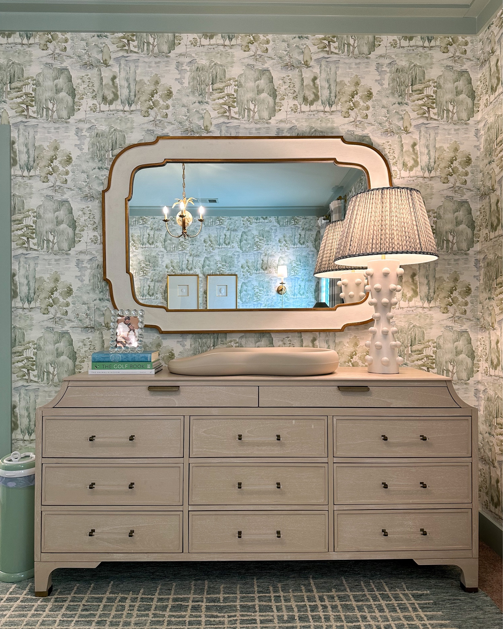 Gabby dresser changing table with Gabby mirror, Regina Andrew bubble lamp with the most divine Fermoie shade from Shade Shop (unable to link). Love every view of his nursery!

Linking everything I can! All the furniture, rug, and almost all lighting are from Mantooth Interiors in Homewood, AL. Give them a call to shop local and support my family’s business 🤍

#nursery #nurserydecor #nurserydesign #nurseryinspo #boynursery #genderneutralnursery #wallpaper #interiordesign #visualcomfort #myballardstyle #reginaandrewdetroit #reginaandrew #serenaandlily #potterybarn #westelm #gabbyhome #namesakecrib

#LTKbaby #LTKkids #LTKhome