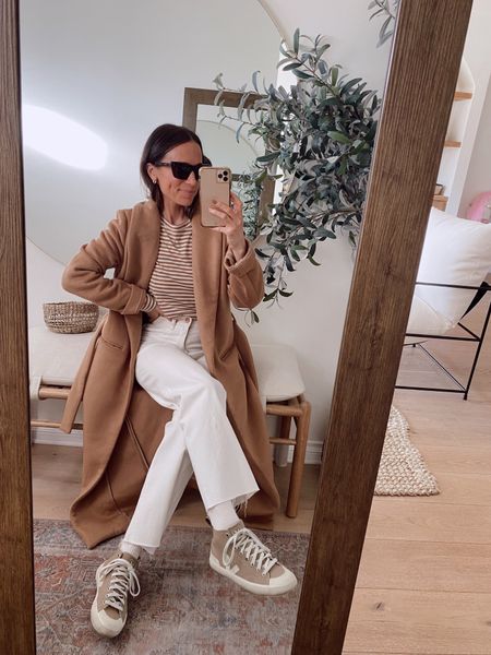 Outfit from January’s capsule wardrobe 
Striped top (Tts) 
Camel coat
Wide legged white jeans 

#LTKstyletip