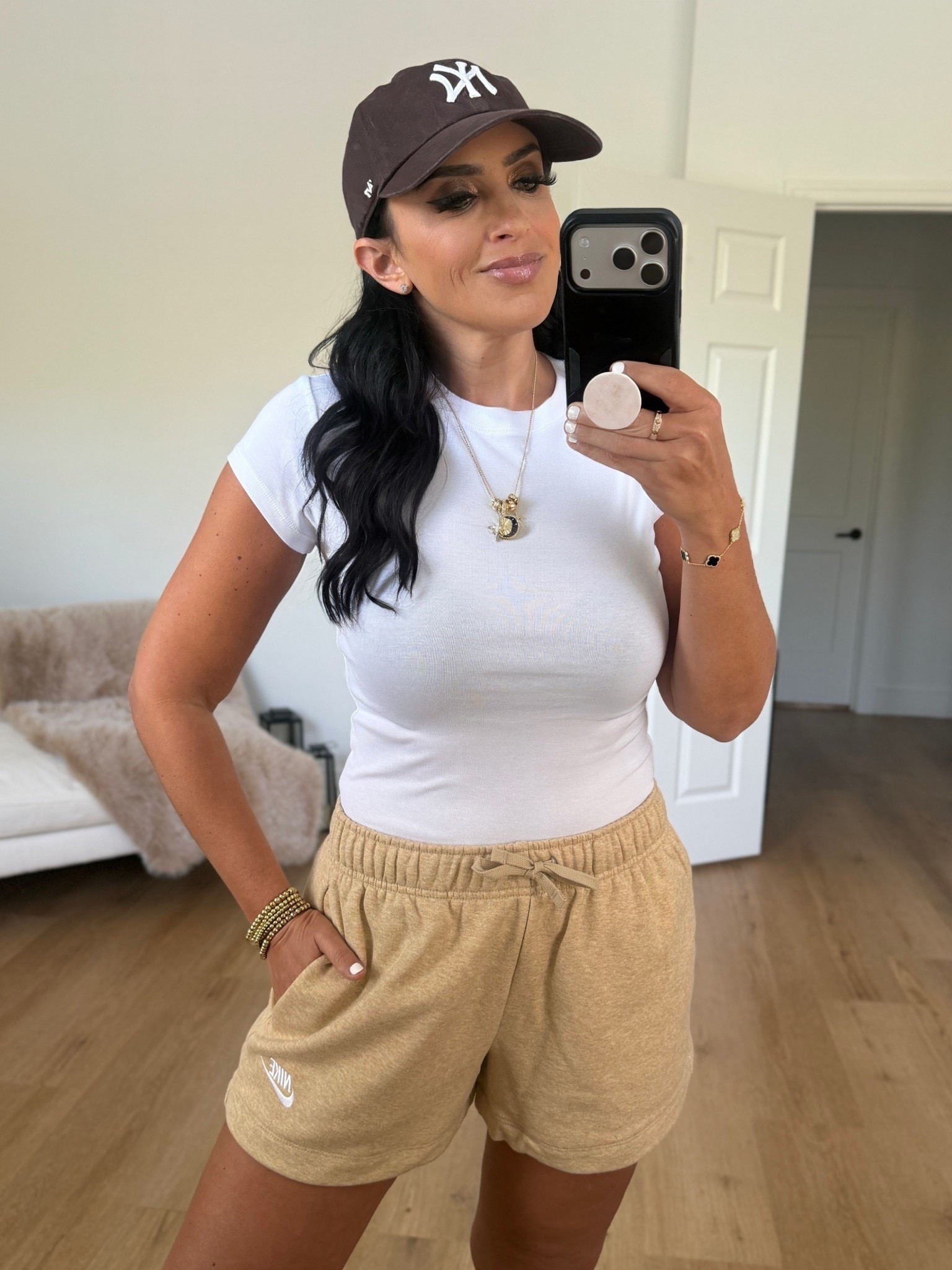 Nike sportswear club fleece women’s mid rise shorts linen heather white wearing size medium 