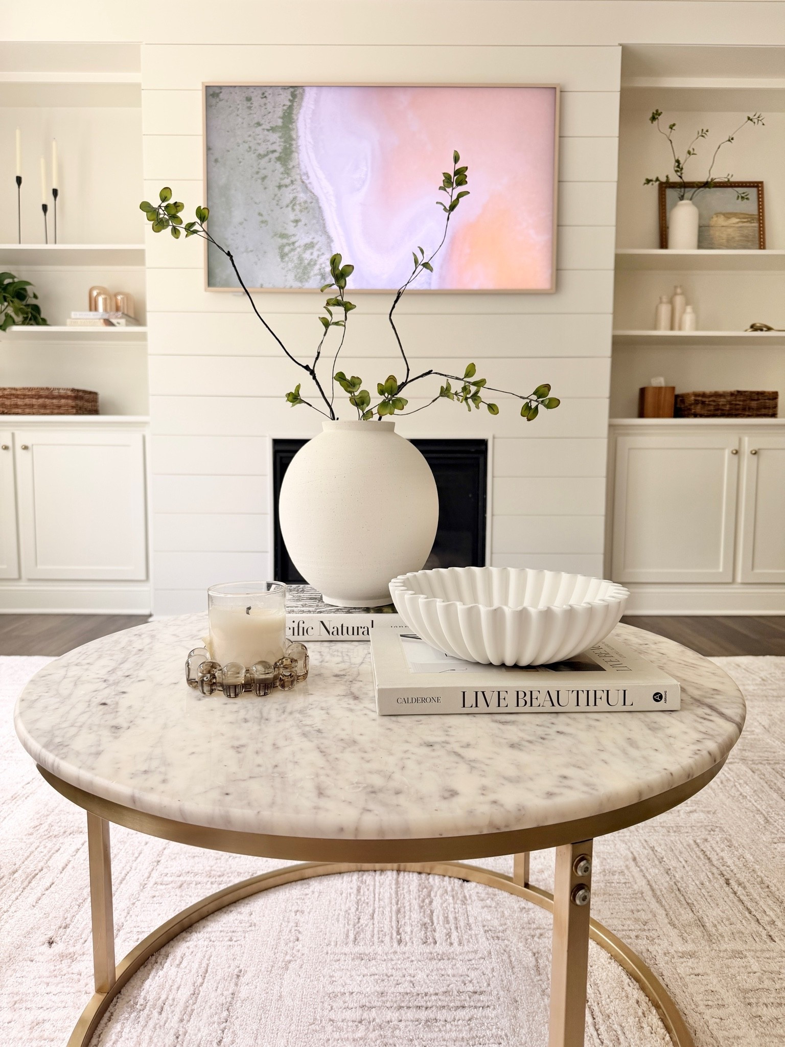 Rug is 9x13 in Ivory Taupe. Brightens up the room against dark floors. TV is 65” 
Coffee table styling. Light and airy decor. Neutral home decor. How to style a coffee table

#LTKmomlife #LTKHome #LTKOver40