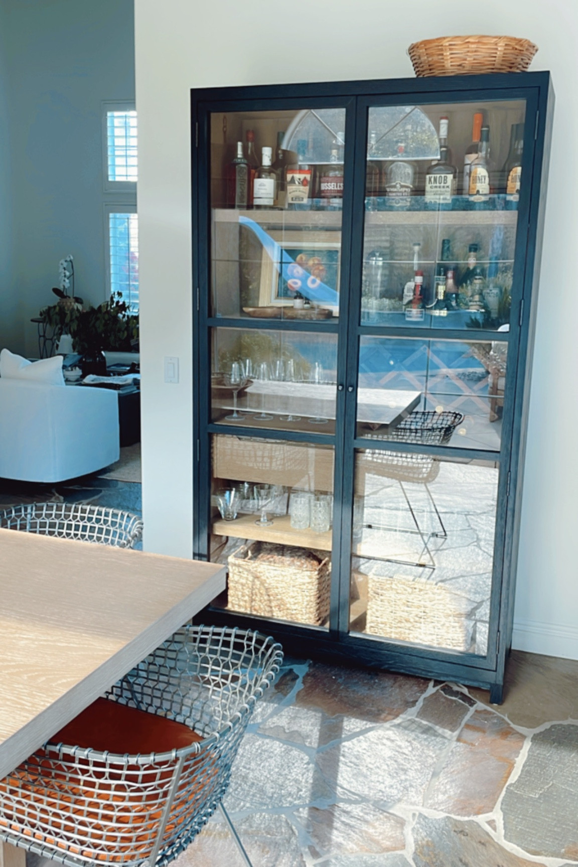 I found a very similar cabinet to the one I ordered for our dining room. Ours is the Millie cabinet by Four Hands Furniture and I’ve seen it available through Lulu & Georgia as well as Burk Decor. The other option is less than 1/3 the price and is available through Ashley Furniture. Both linked here! #curiocabinet #wetbar #barcabinet #diningroom 