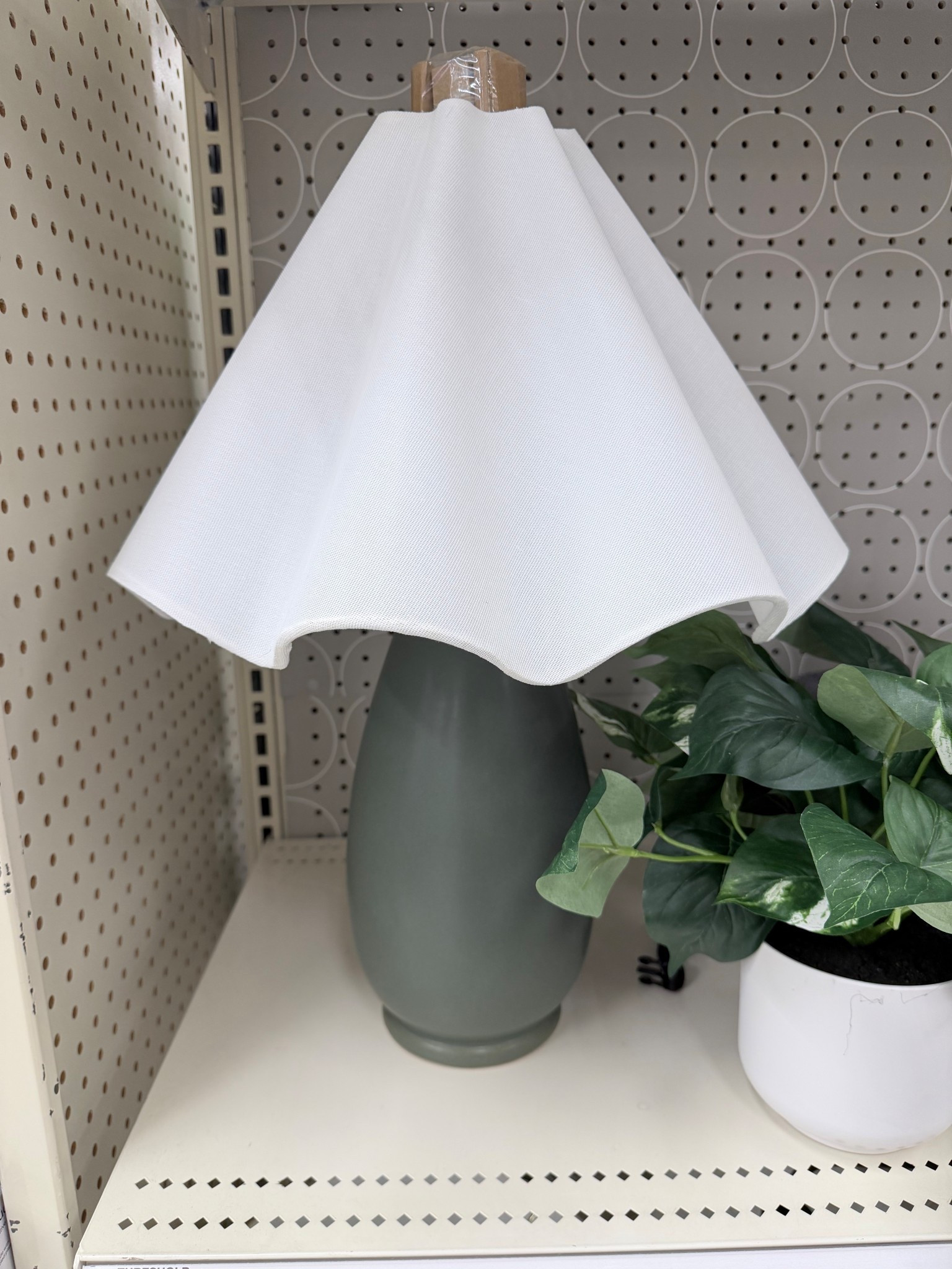 Affordable table lamp with wavey shade. Green base.
Target find 

#LTKHome