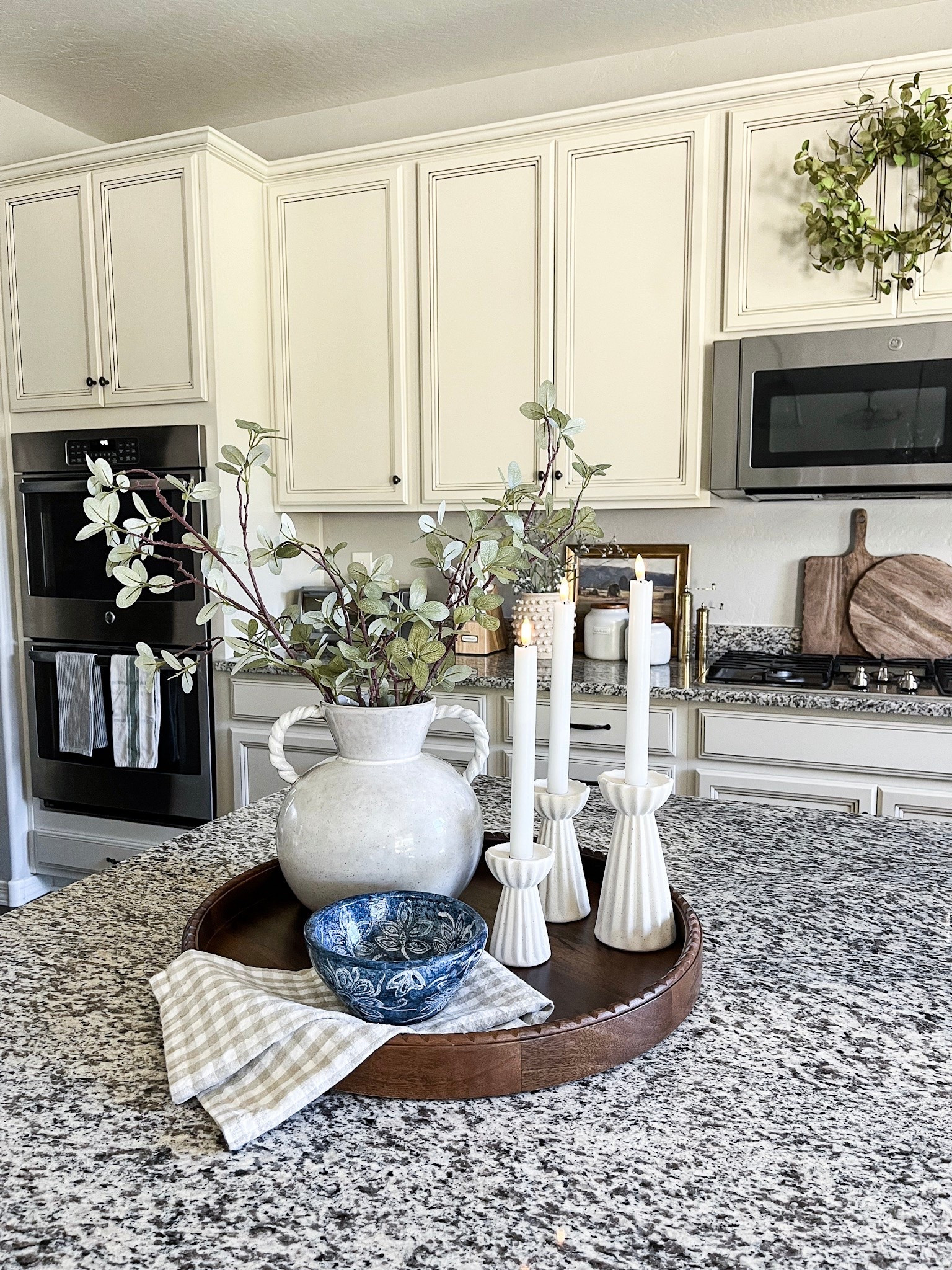 Early summer tray styling!

My favorite round wood tray, greenery, flameless candles, this adorable neutral gingham towel, and this beautiful blue bowl all help create this simple summer tray that is the perfect addition to my kitchen island or table centerpiece.

#traystyling #centerpiece #kitchenstyling #kitchendecor #summerdecor #homedecor

#LTKHome #LTKSeasonal