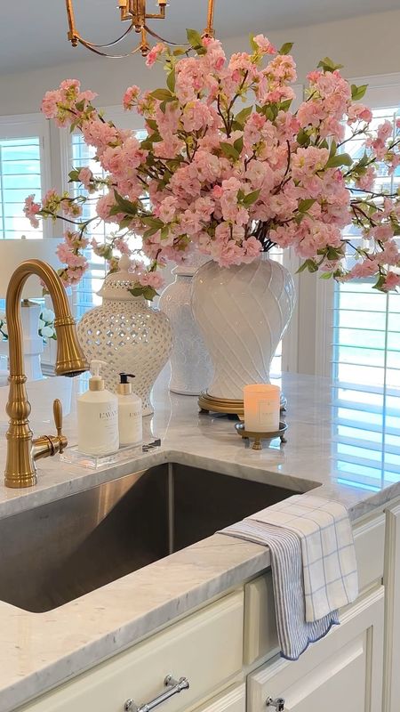 25% off cherry blossoms ends today!! They would make such a lovely Mother’s Day gift! 🌸💗 I used 12 stems here. I also have a 20% off code for my soap, lotion and lucite tray. Use code: Jasmin20

Kitchen styling kitchen island decor spring decor acrylic tray gold faucet B429

#LTKhome #LTKsalealert #LTKfindsunder50