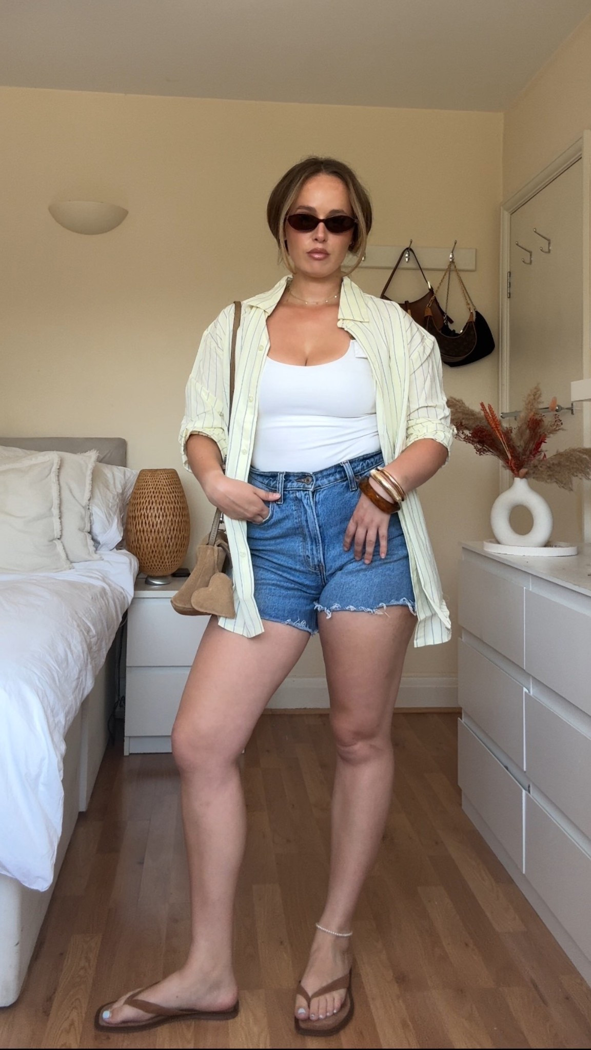 Easy summer layers 🍋 Denim cutoffs, a classic tank, and the oversized striped shirt I throw over everything. This whole look is giving ‘Zara girl on holiday’ vibes — I’ve linked similar staples while I (impatiently) wait for Zara to approve me on LTK 😭”

#LTKsummer #LTKstyle #EverydayOutfit #MinimalOutfitIdeas #EffortlessStyle #SummerLayers #DenimShorts

#LTKeurope #LTKsummer #LTKuk