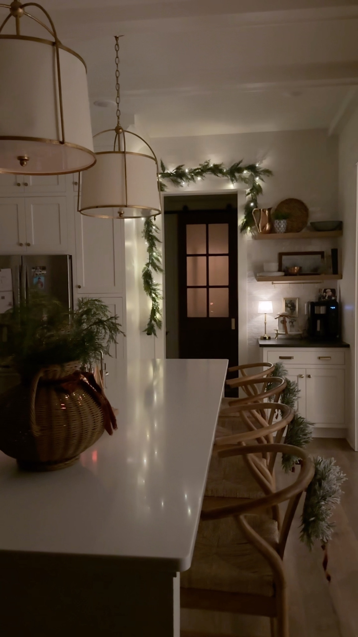 This year, I added some garland over the doorway to our pantry, and it brings the most beautiful glow in the evenings. I wrapped a battery-powered strand of lights around it, and the soft twinkle feels so cozy. The garland itself was from Target years ago and has since been discontinued, but I’m linking some similar options that give the same look.

#LTKSeasonal #LTKHoliday