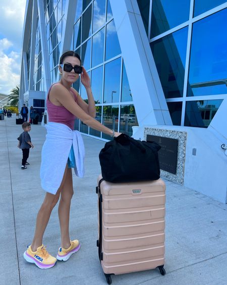 Travel outfit ✈️ this suitcase and huge bag are two of my travel essentials - the bag holds sooo much 🙌🏼

Sizing:
Top- medium 
Shorts - small

Travel outfit; athleisure outfit; workout outfit; travel style; mom style; amazon luggage; Amazon suitcase; travel bag; Hoka sneakers; Chanel sunglasses

#LTKtravel #LTKstyletip #LTKunder100