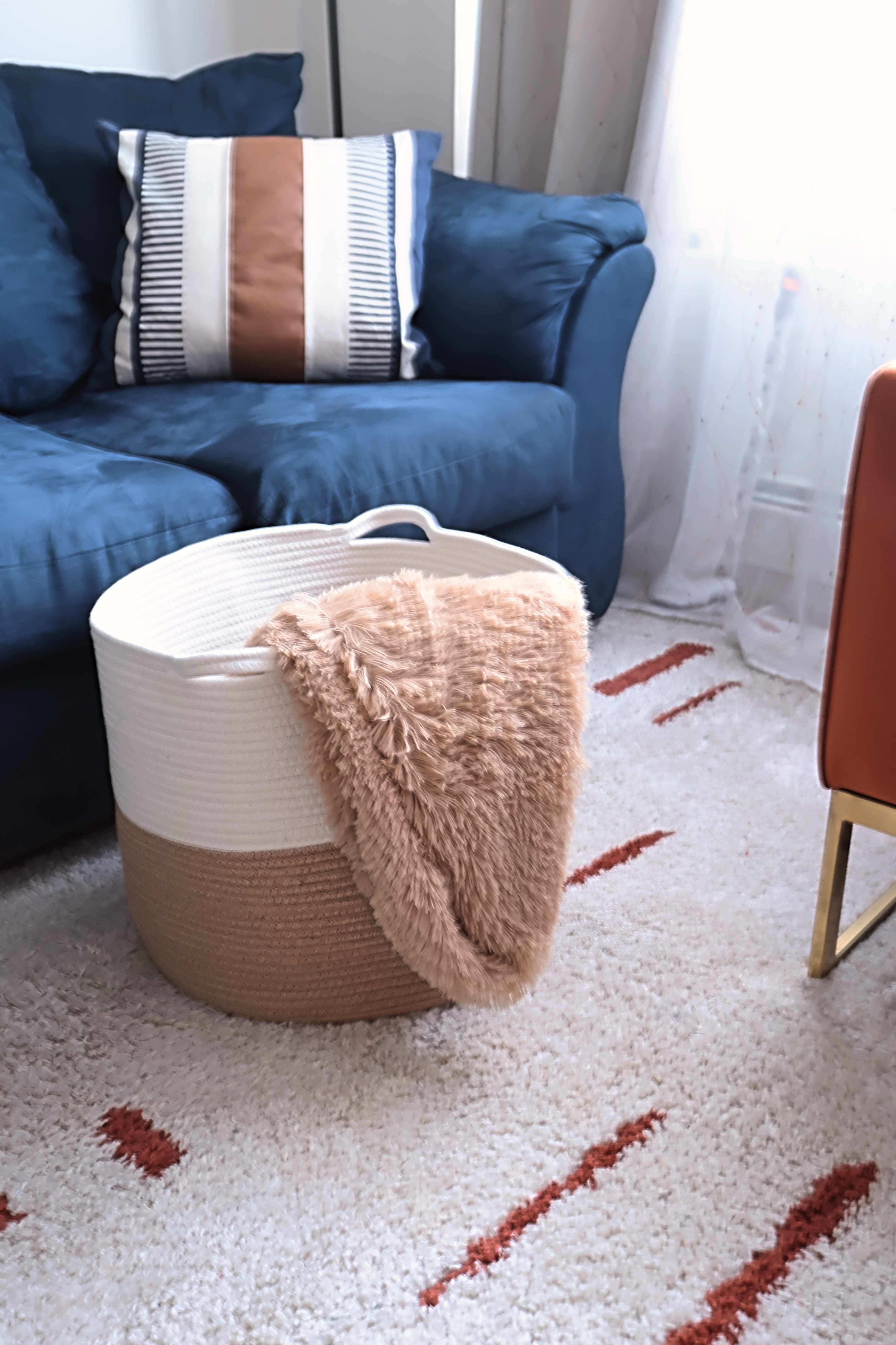 For my winter home decor I found this large woven basket to hold all my throw blankets. It went perfectly with my living room decor.  Plus it keeps clutter away. 

#LTKHome #LTKFindsUnder50