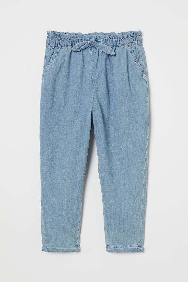 Pants in soft cotton fabric. Waistband with attached bow, ruffle trim, and covered elastic. Mock ... | H&M (US)