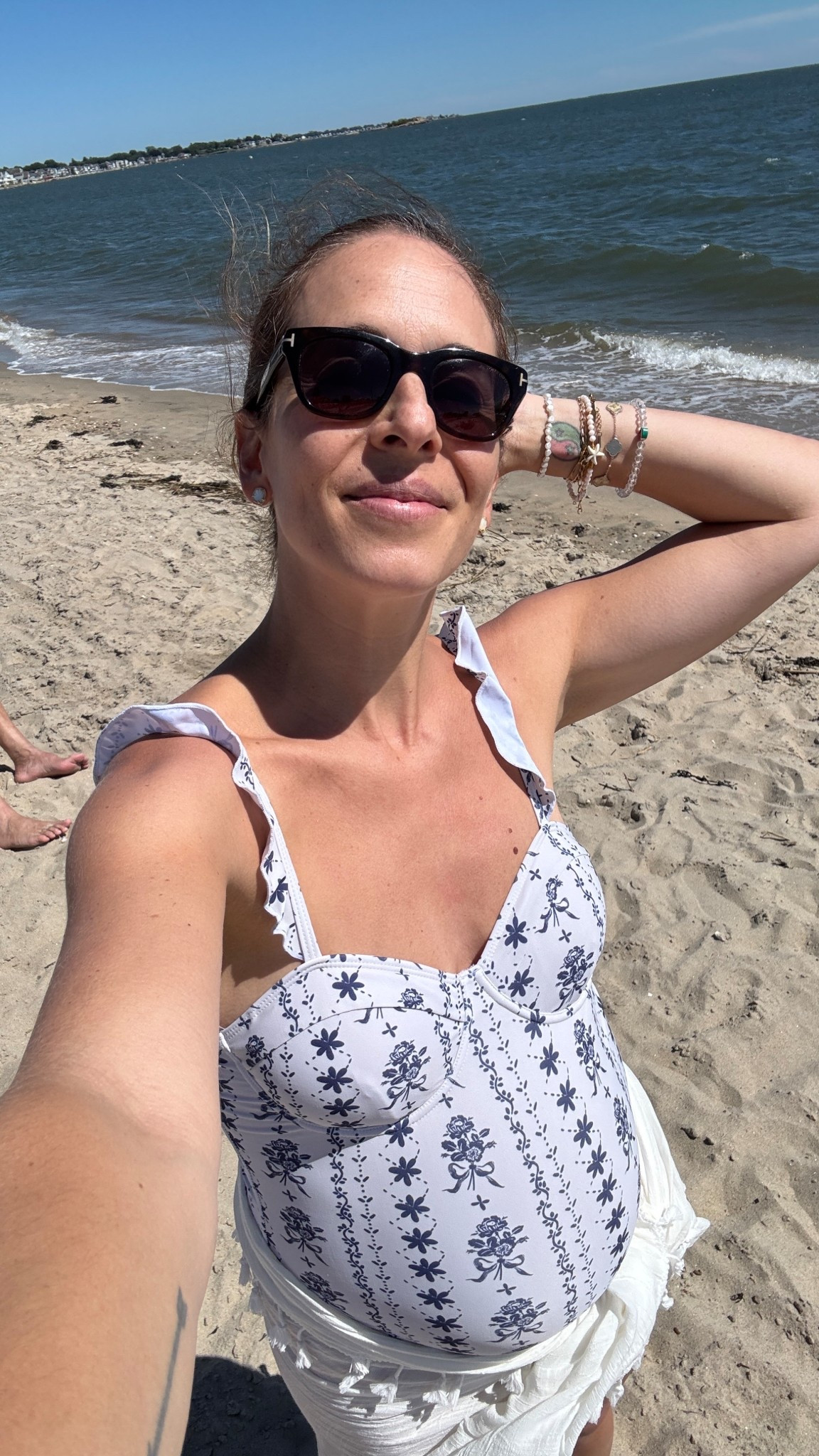 Bump friendly one piece bathing suits that don’t break the bank were my most sought after pieces this summer, and this beautiful blue and white floral and bow detail ruffle strap one piece is so cute and under $30! Linked it and my sunnies, coverup, and jewelry worn here at the beach 

#LTKFindsUnder50 #LTKSwim #LTKSaleAlert