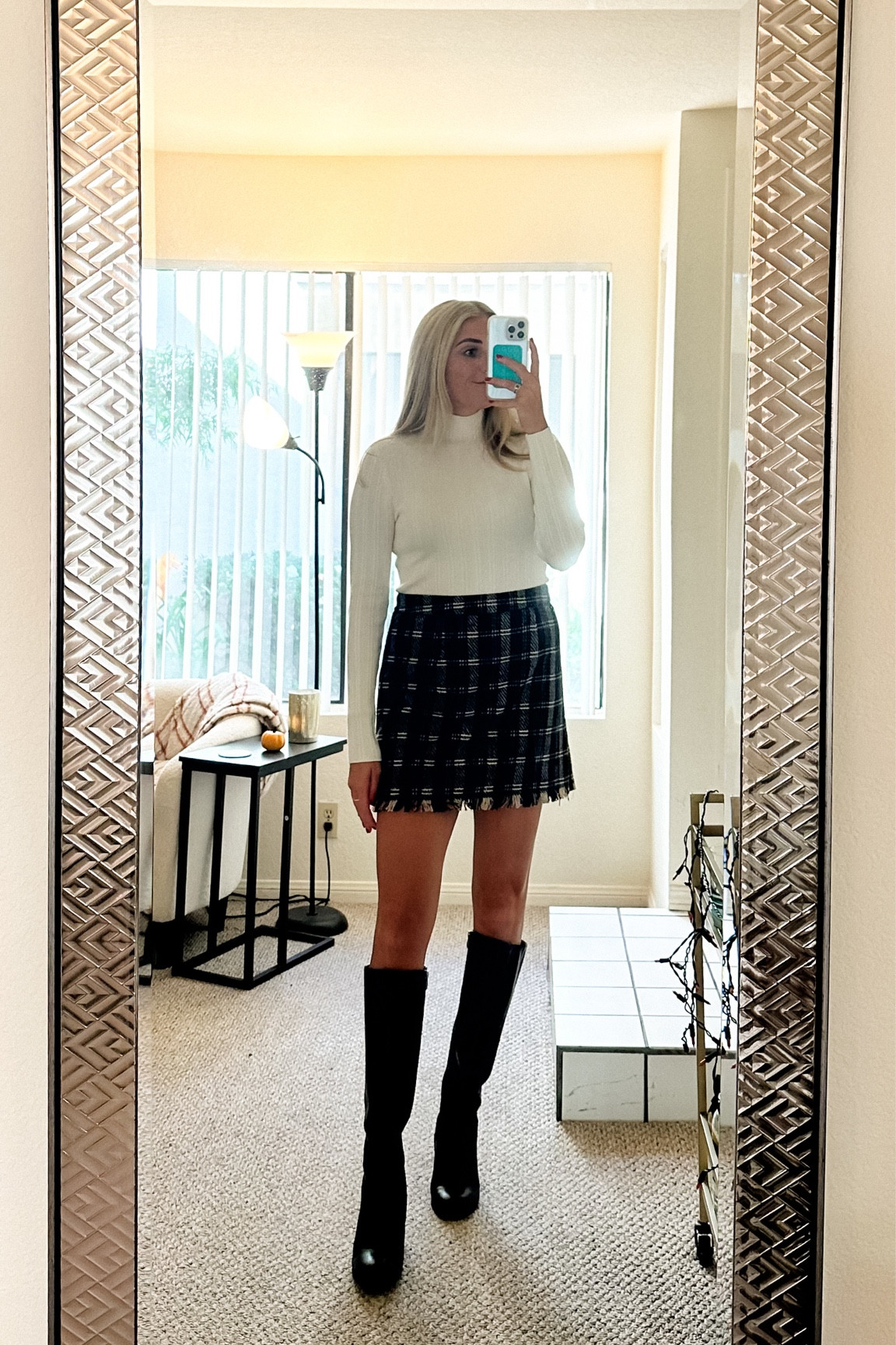 holiday outfit inspo | white turtleneck and plaid skirt with boots 
