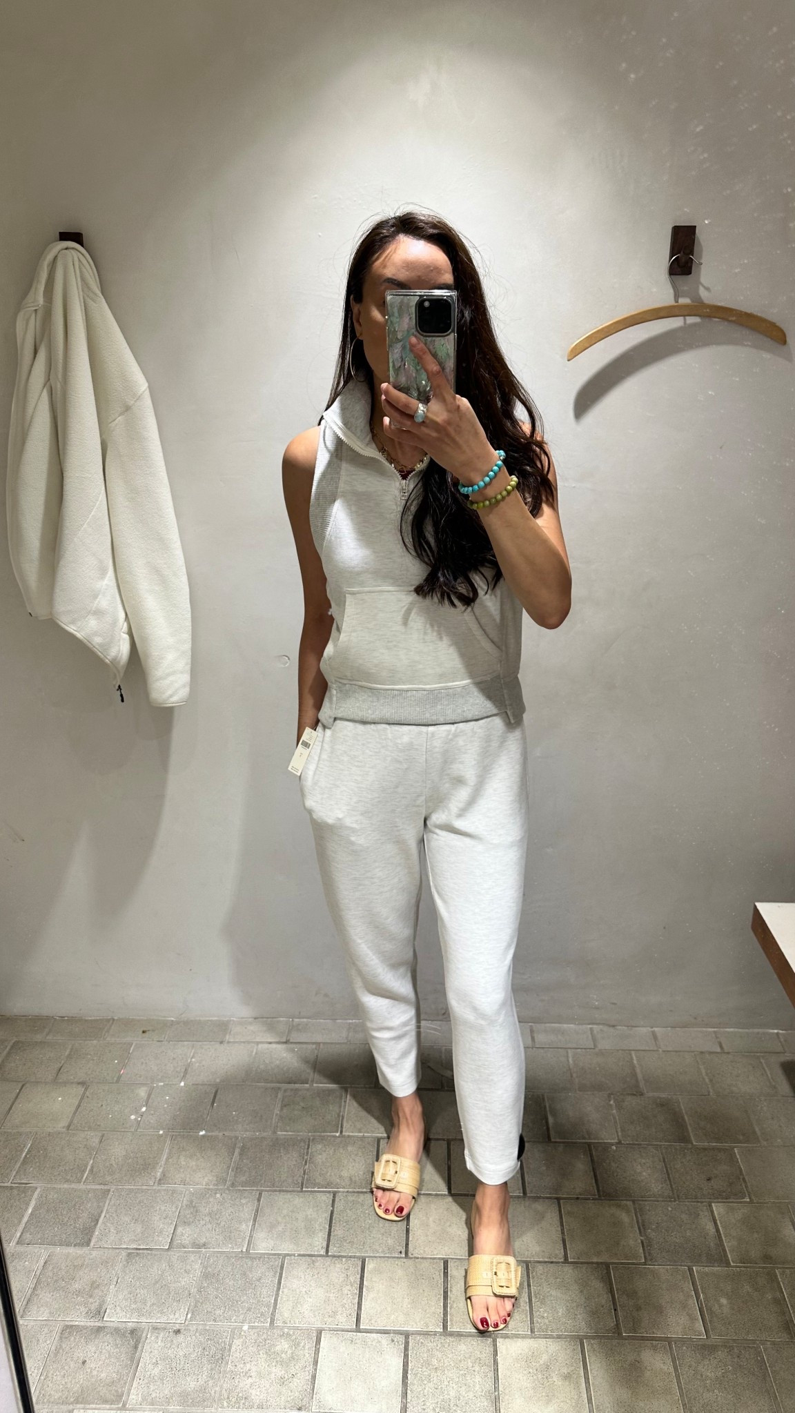 Size small Varley slim pants in ivory 25” inseam (can get longer in 27.5”) with Daily New Wave half zip vest in size xs 

Travel airport outfit loungewear can wear a long sleeve under for layering 

#LTKOver40 #LTKActive