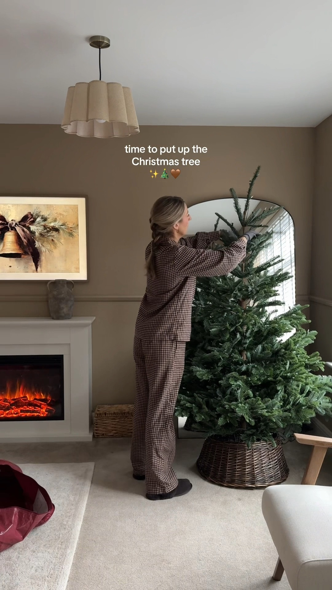 Putting up the Christmas tree 🤎🎄

Tree skirt, paper decorations, velvet baubles, pre lit Christmas tree, gingham pyjamas 

#LTKfestive #LTKhome #LTKCyberWeek