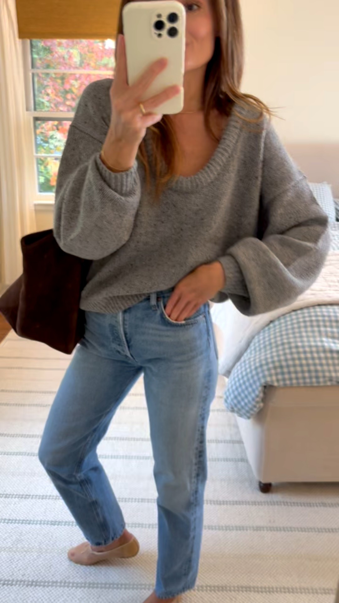 Sharing a little bit more about this OOTD! This bohme Fern sweater is one of the finds I’m most excited about in a long time! The deep scooped neckline is gorgeous. You can wear it with a crewneck tee or without if you want to show off your neck or a little jewelry. I truly can’t believe it’s less than $70! • Favorite jeans AGOLDE 90’s. • Can’t say enough of these Loeffler Randall Landon ballet flats. They look beautifully delicate but they’re so sturdy and I am getting great mileage out of them • Liffner Sprout tote is such a great way to tie an outfit together. It’s a statement piece and incredibly practical. 

I truly love it all but this sweater is the star of the show especially at such an incredible price point!

Happy Monday all. Let’s make it a great one 🤍🤍🤍

#LTKSeasonal #LTKStyleTip #LTKFindsUnder100