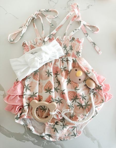Baby girl strawberry ruffle bubble romper! I love the bow tie straps, the ruffle in the back and the strawberry design. Super soft! 

#LTKbaby #LTKstyletip