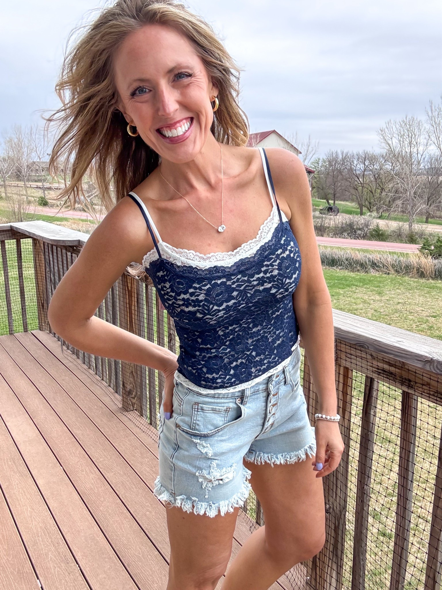 This double layered lace tank top in blue is so adorable! 💙 I now want this in all the colors! Wearing an xsmall.

As an Amazon Influencer I earn commission on qualifying purchases.

Lace tank top, denim shorts, spring style 2026, summer fashion, trendy top, date night outfit inspo, casual summer look 

#LTKOver40 #LTKootd #LTKMidsize