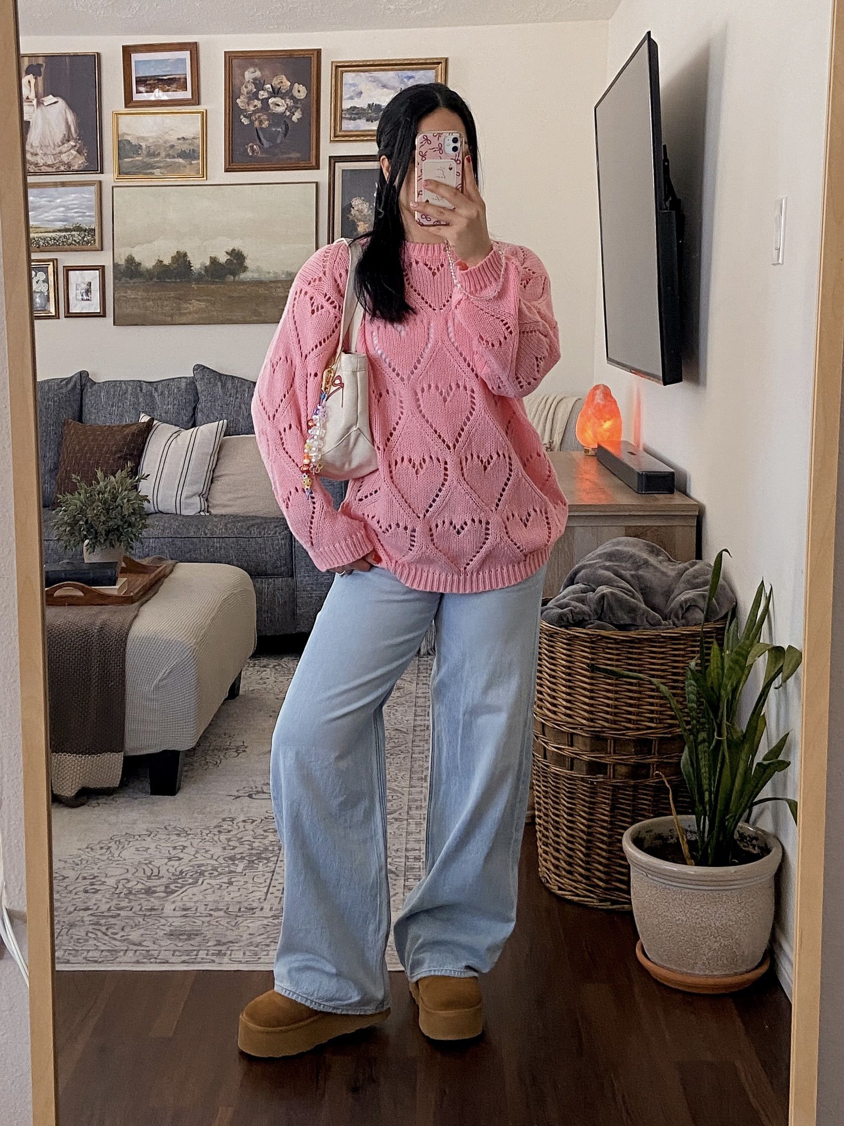 first ootd of 2026! 💕🎀 pink oversized sweater outfit, heart knit sweater outfit, cozy winter outfit inspo, casual chic winter outfit, comfy cute outfit idea, winter casual fashion, oversized sweater styling, baggy jeans outfit, light wash denim outfit, cozy aesthetic outfit, pink heart sweater, oversized pink sweater, heart pattern knit sweater, baggy light wash jeans, platform ugg boots outfit, ugg inspired winter outfit, pink hair bow aesthetic, feminine winter outfit, cozy girly style, baublebar tote bag, baublebar custom tote, baublebar bag charms, charm covered tote bag, personalized tote bag, cute tote bag aesthetic, y2k bag charms, playful accessories trend, girly aesthetic outfit, pinterest inspired outfit, cozy cute vibes, soft girl winter outfit, feminine casual style, playful winter fashion, cozy aesthetic fashion, everyday winter outfit inspo  

 #LTKSeasonal #LTKU #LTKFindsUnder50