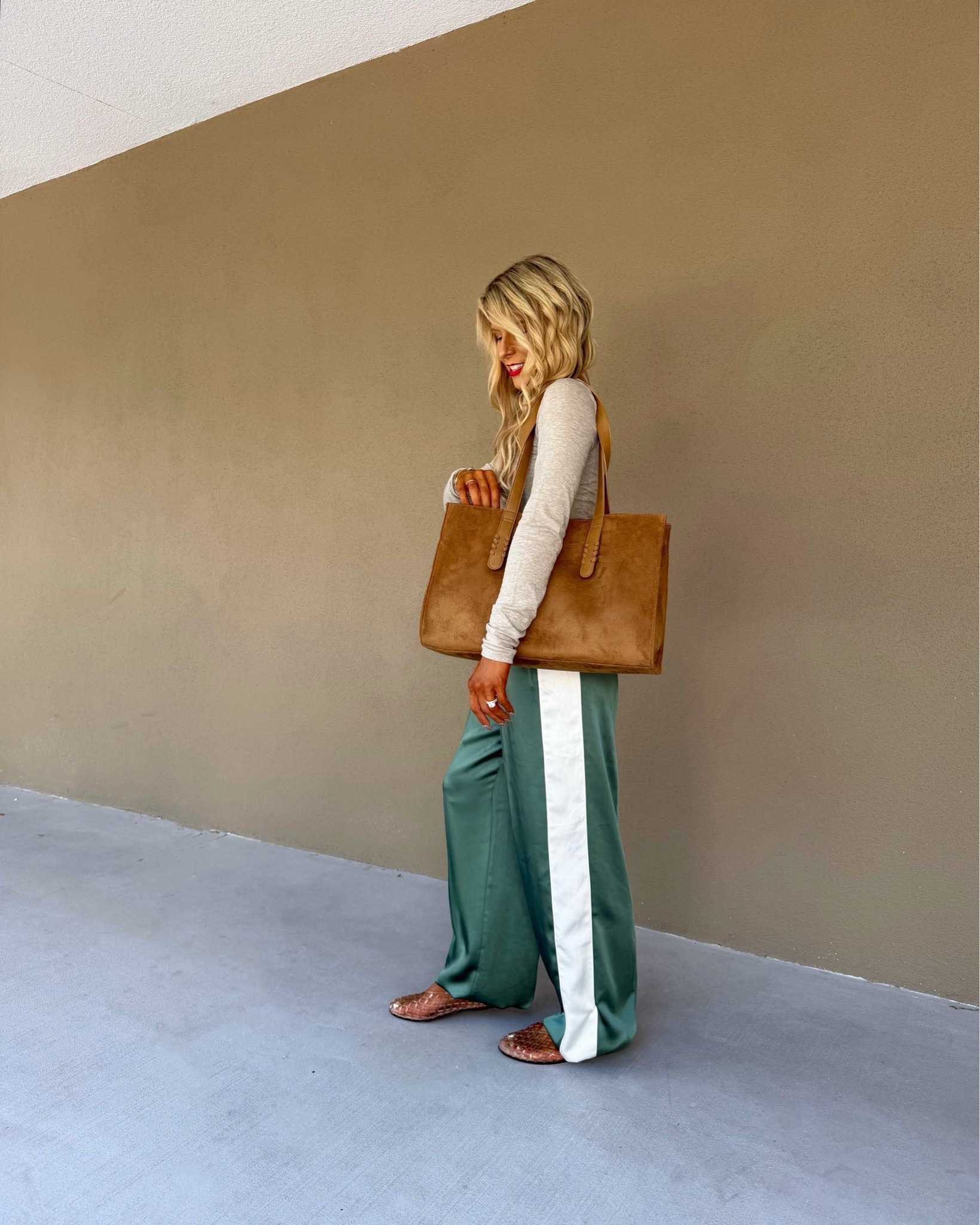 Trendy casual fall outfit styled with green track pants + a brown suede bag. 

Casual outfit, fall pants, travel outfit, everyday fall outfit, Petite fall outfit, easy fall outfit, sporty outfit, fall fashion trends 2026

#LTKootd #LTKSaleAlert #LTKPetite